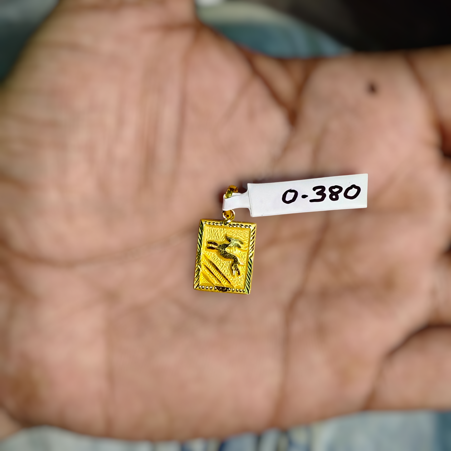 (GLKD) LOCKET WGT: 0.380 GM APPROX KDM GOLD LOCKET 1 PIECE (50 TONCH) WITH ADJUSTABLE TASSEL FOR GIFTING PURPOSE (CHAIN NOT INCLUDED).