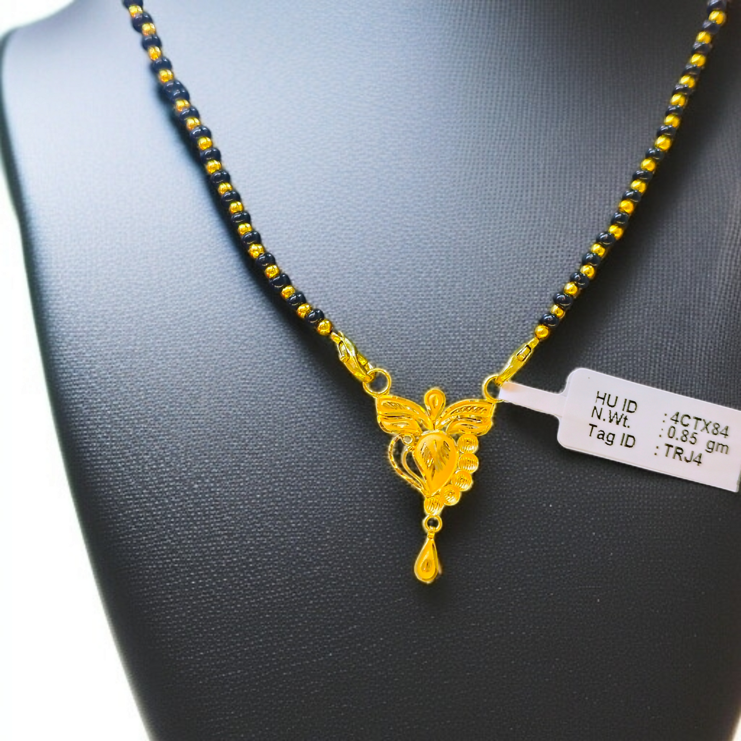 TRJ WGT: 0.850 GM APPROX 22KT HUID HALLMARK GOLD PENDANT MANGALSUTRA 1 PIECE WITH TASSEL.