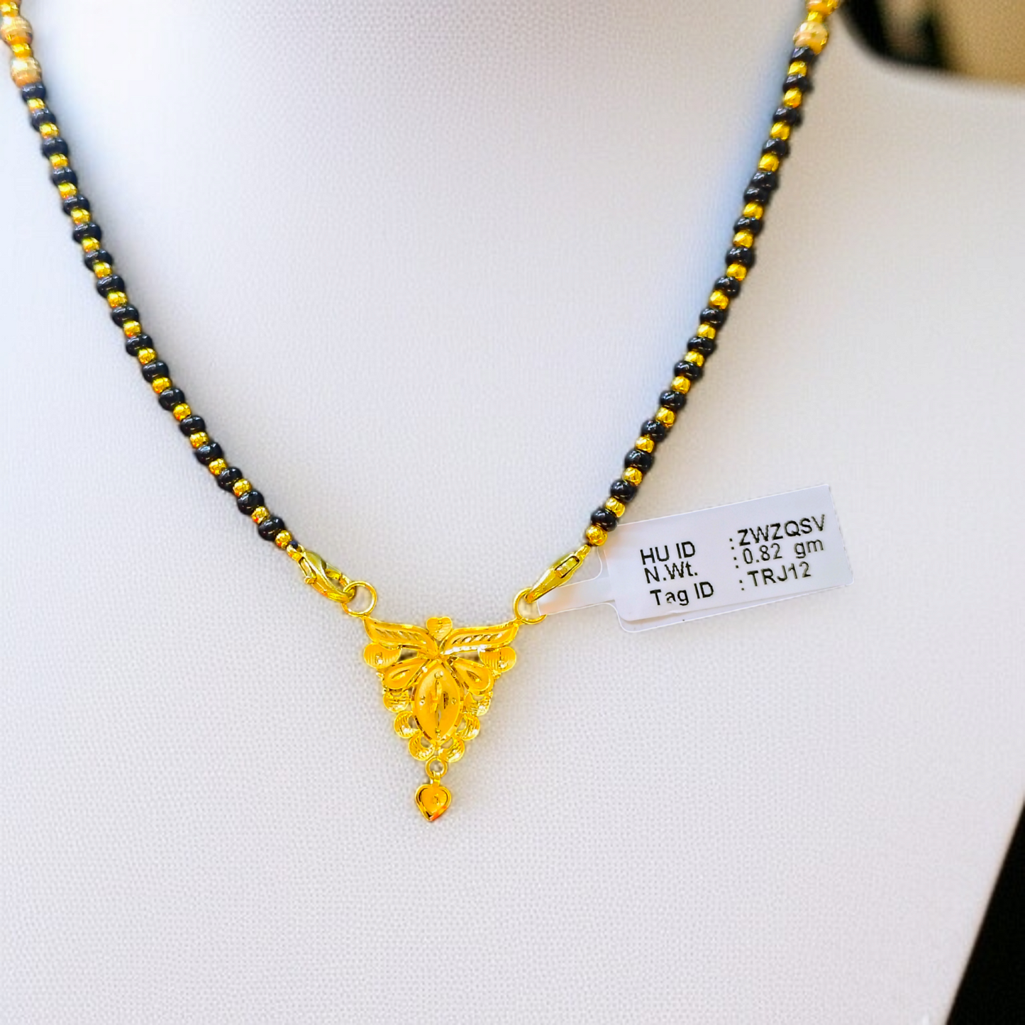 TRJ WGT: 0.820 GM APPROX 22KT HUID HALLMARK GOLD PENDANT MANGALSUTRA 1 PIECE WITH TASSEL.