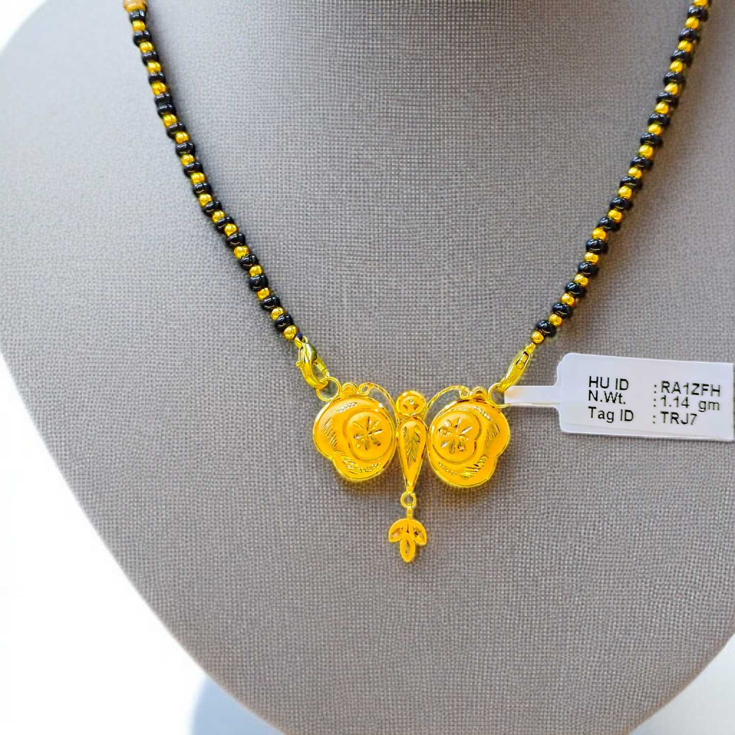 TRJ WGT: 1.140 GM APPROX 22KT HUID HALLMARK GOLD PENDANT MANGALSUTRA 1 PIECE WITH TASSEL.