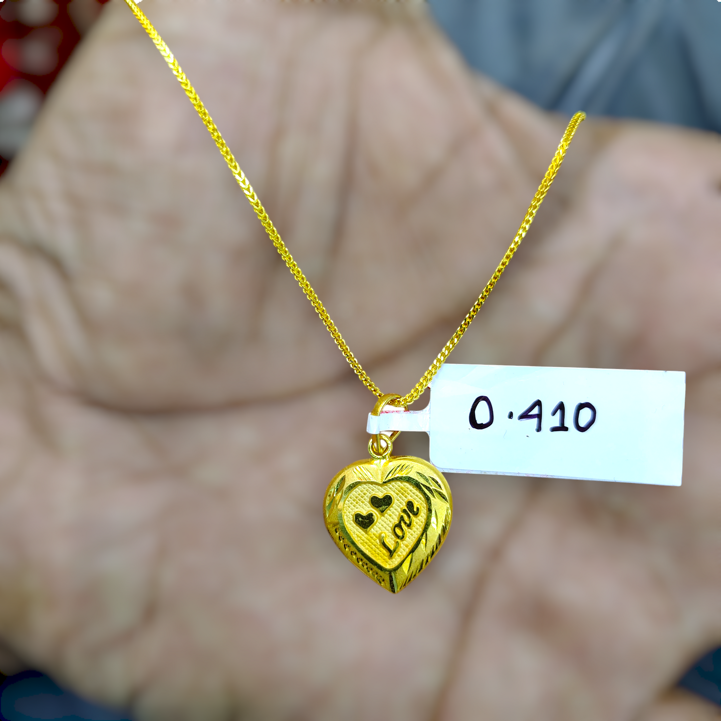 TRJ WGT: 0.410 GM APPROX KDM GOLD LOCKET 1 PIECE (50 TONCH) WITH ADJUSTABLE TASSEL.