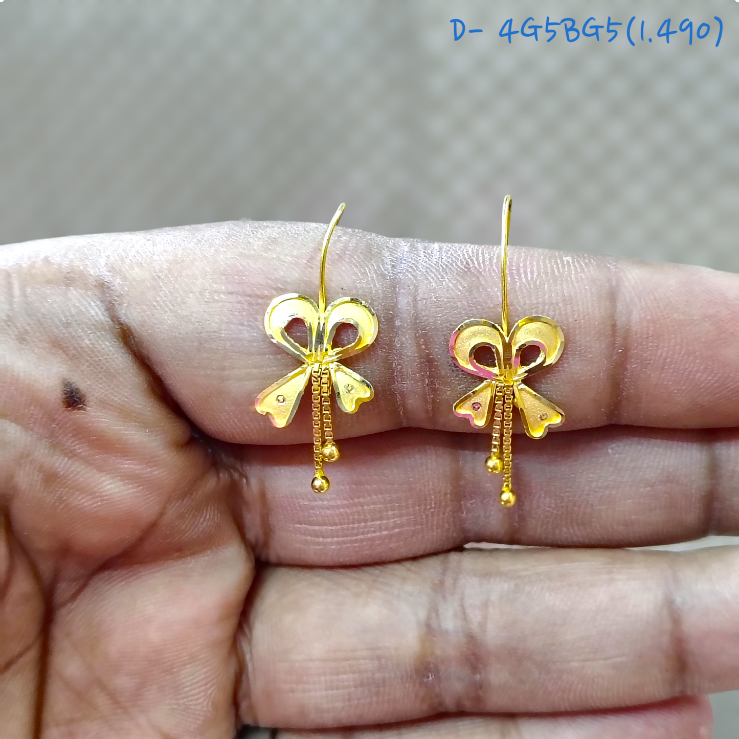 RAJLAXMI D- 4G5BG5 WGT: 1.490 GM APPROX HUID HALLMARK 916 22KT GOLD BOW EAR TOPS STUD 1 PAIR FOR REGULAR USE.