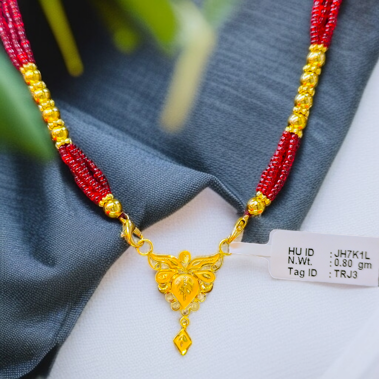 TRJ WGT: 0.800 GM APPROX 22KT HUID HALLMARK GOLD PENDANT MANGALSUTRA 1 PIECE WITH TASSEL.
