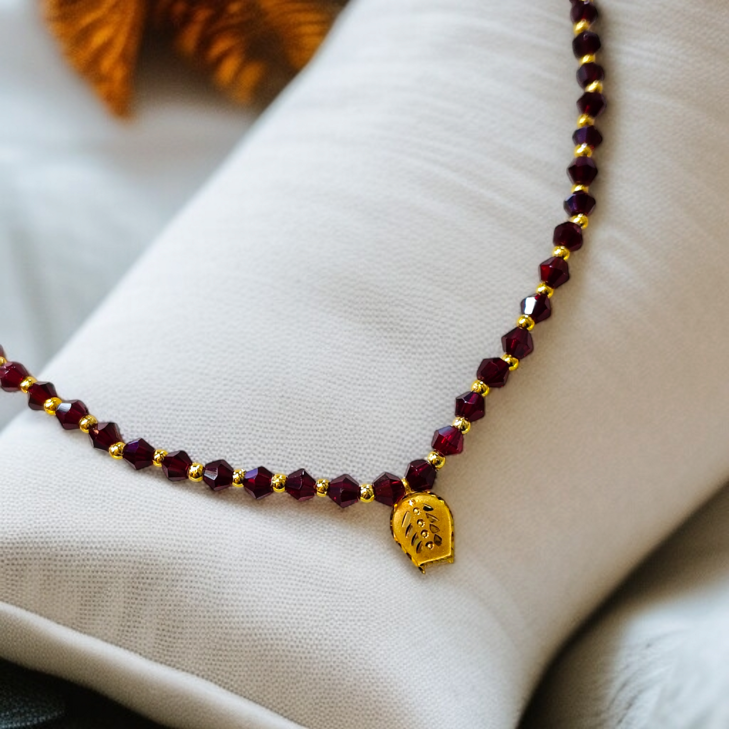 (CHALLENGE ON PRICE) TRJ WGT: 0.100 GM APPROX KDM GOLD KULO DESIGN LOCKET 1 PIECE WITH MAROON CRYSTAL ADJUSTABLE TASSEL FOR GIFT PURPOSE (50 TONCH).