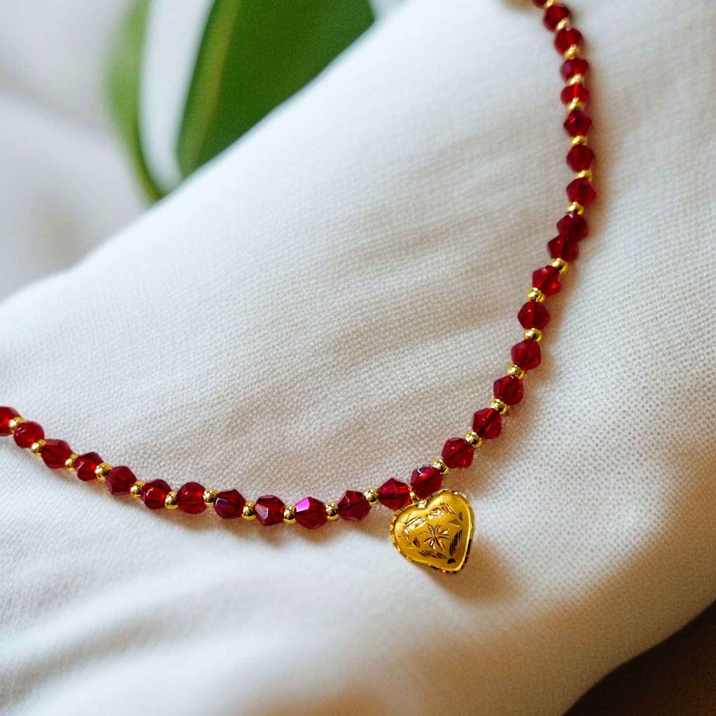 TRJ WGT: 0.150 GM APPROX KDM GOLD LOVE DESIGN LOCKET 1 PIECE WITH RED CRYSTAL ADJUSTABLE TASSEL FOR GIFT PURPOSE (50 TONCH).