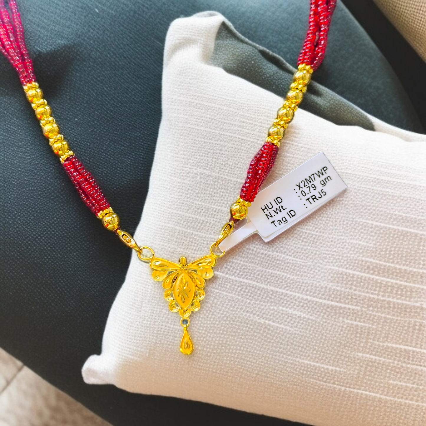 TRJ WGT: 0.790 GM APPROX 22KT HUID HALLMARK GOLD PENDANT MANGALSUTRA 1 PIECE WITH TASSEL.