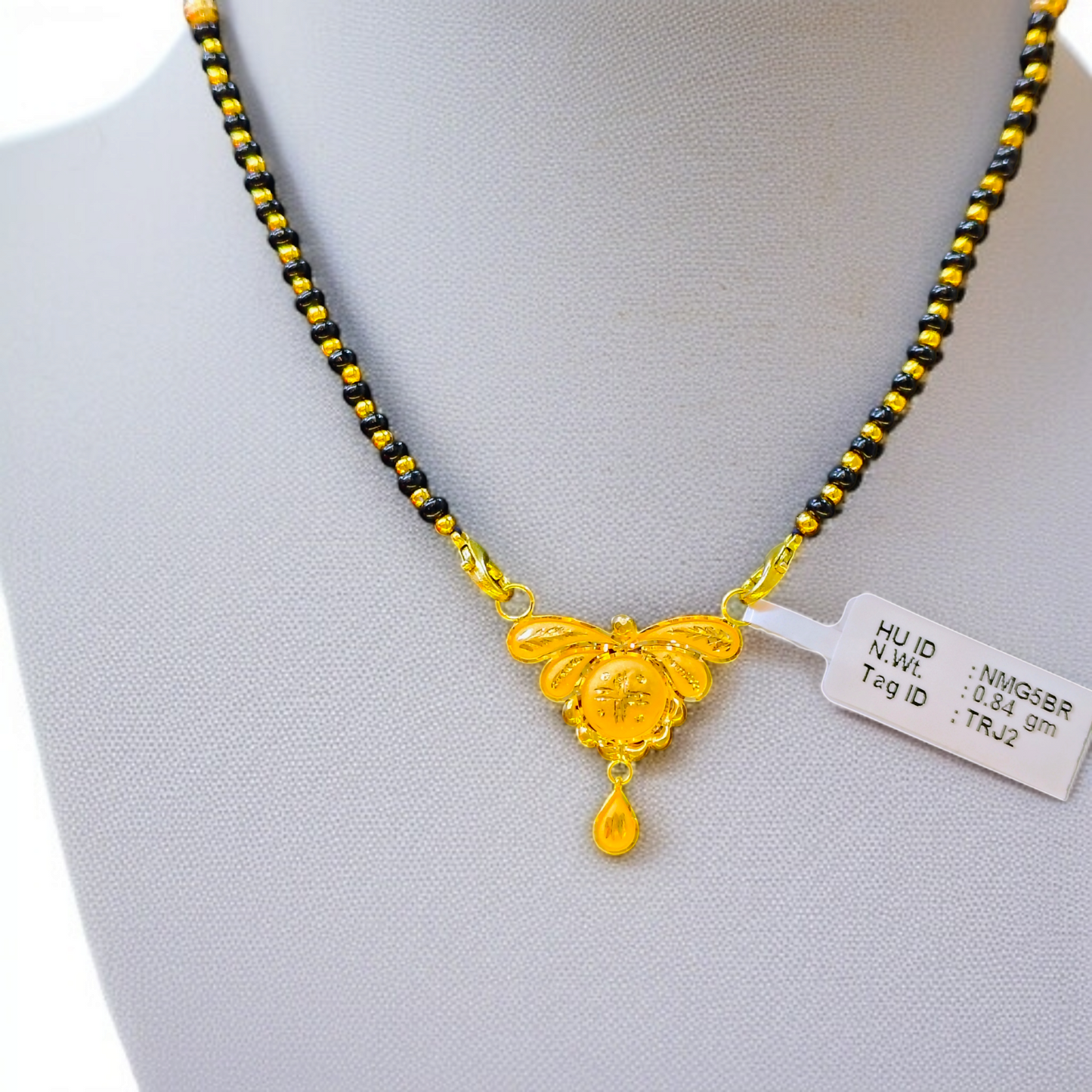 TRJ WGT: 0.840 GM APPROX 22KT HUID HALLMARK GOLD PENDANT MANGALSUTRA 1 PIECE WITH TASSEL.