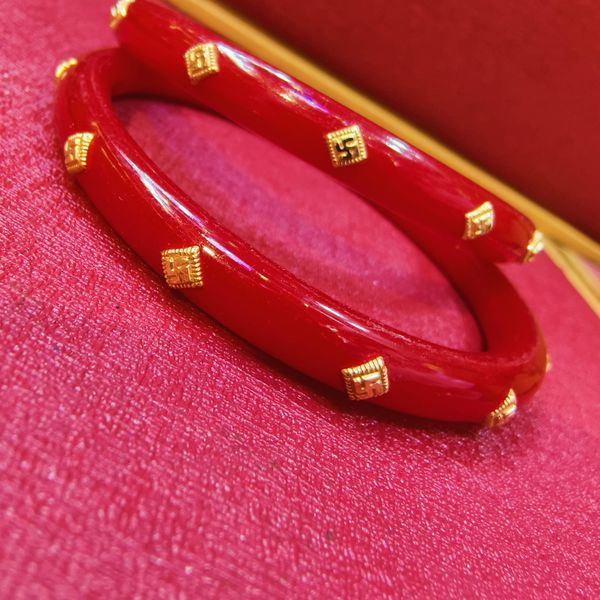 (GPPB) RED SWASTIK MEDIUM LOCAL (50 TONCH) KDM GOLD POLA BADHANO 1 PAIR FOR REGULAR USE APPROX WGT: 0.400 GM (NOTE: DEDUCTION OF WGT: 0.100 GM WHEN EXCHANGED WITH ANY JEWELLERY FOR LIFETIME)