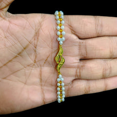 GOLD MOTI WRISTLET- (68F5KI) (WGT: 0.220 GM APPROX) BIS CERTIFIED HUID HALLMARK 375 9KT GOLD WRISTLET (BRACELET) WITH MOTI CHAIN FOR WOMEN (ADJUSTABLE SIZE).