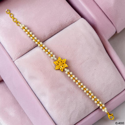 GOLD MOTI WRISTLET- (68ZLV7) (WGT: 0.400 GM APPROX) BIS CERTIFIED HUID HALLMARK 375 9KT GOLD WRISTLET (BRACELET) WITH MOTI CHAIN FOR WOMEN (ADJUSTABLE SIZE).