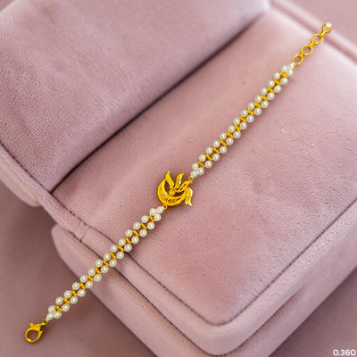 GOLD MOTI WRISTLET- (X7E6BH) (WGT: 0.360 GM APPROX) BIS CERTIFIED HUID HALLMARK 375 9KT GOLD WRISTLET (BRACELET) WITH MOTI CHAIN FOR WOMEN (ADJUSTABLE SIZE).
