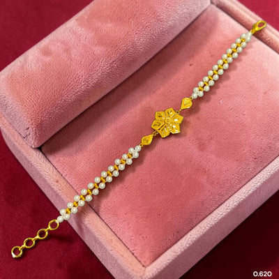 GOLD MOTI WRISTLET- (1CJD15) (WGT: 0.620 GM APPROX) BIS CERTIFIED HUID HALLMARK 375 9KT GOLD WRISTLET (BRACELET) WITH MOTI CHAIN FOR WOMEN (ADJUSTABLE SIZE).