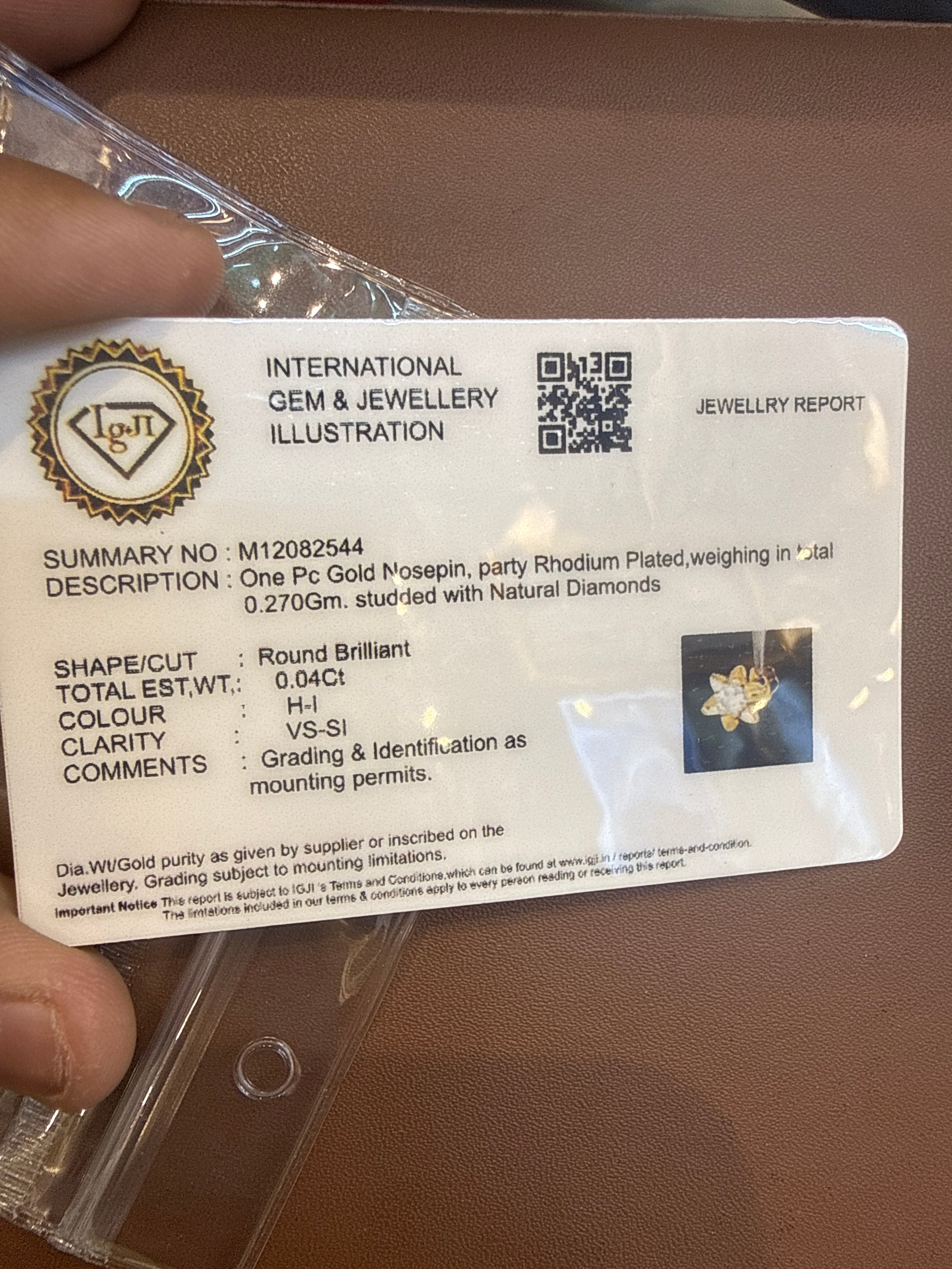 NOSEPIN- RAJLAXMI DIAMOND JEWELLERY - WGT: 0.270 GM - NATURAL DIAMOND (0.04 CENT) HUID HALLMARK 18KT DIAMOND NOSEPIN FOR WOMEN WITH CERTIFICATE OF AUTHENTICITY BY IGJI (DESIGN NO: M12082544).