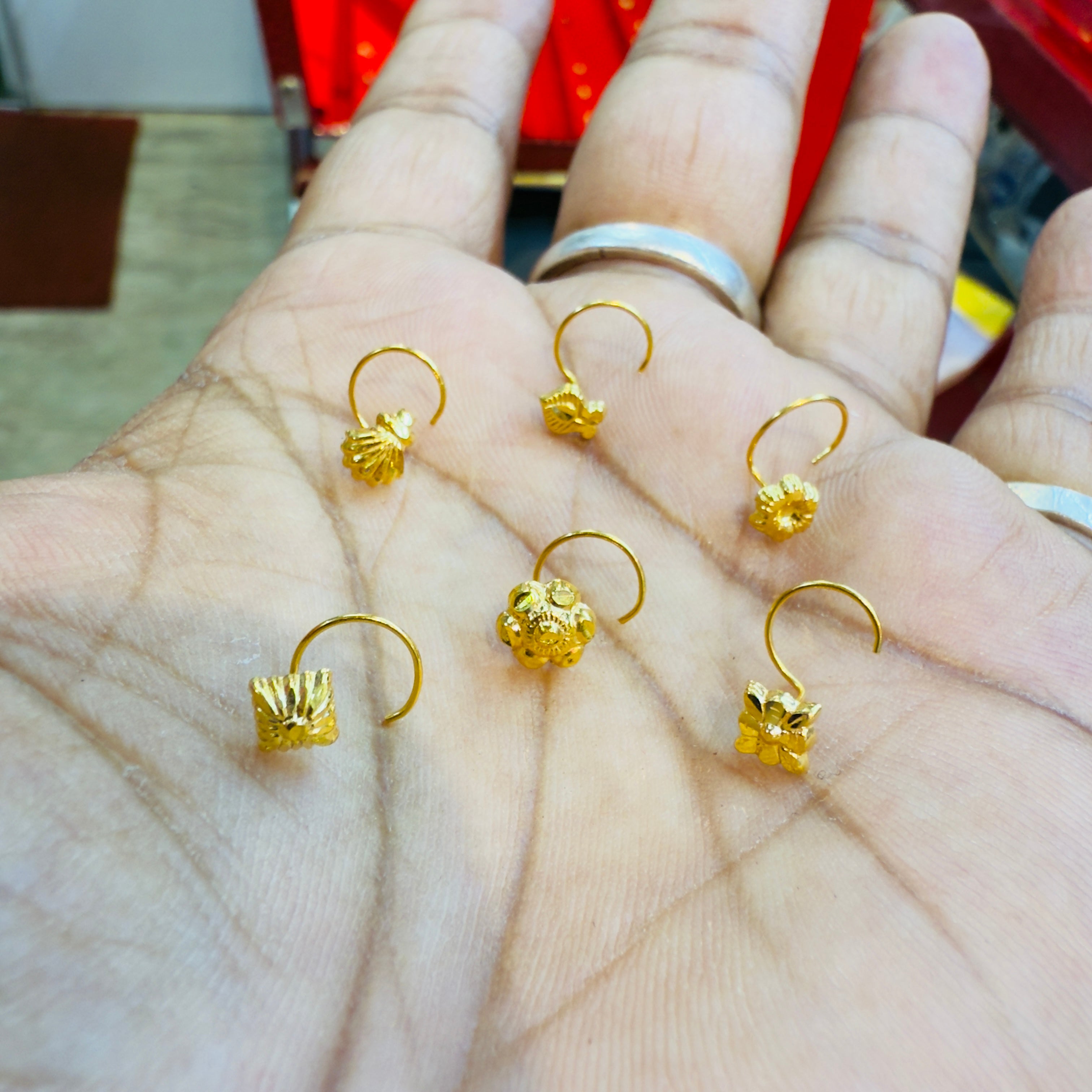CHALLENGE ON PRICE (GNP) NOSEPIN WGT: 0.100 GM APPROX. HUID HALLMARK 9KT GOLD NOSEPIN 1 PIECE FOR GIFTING YOU LOVED ONES. (GET ANY DESIGN AS PER AVAILABLITY)- SOLD ON MRP.