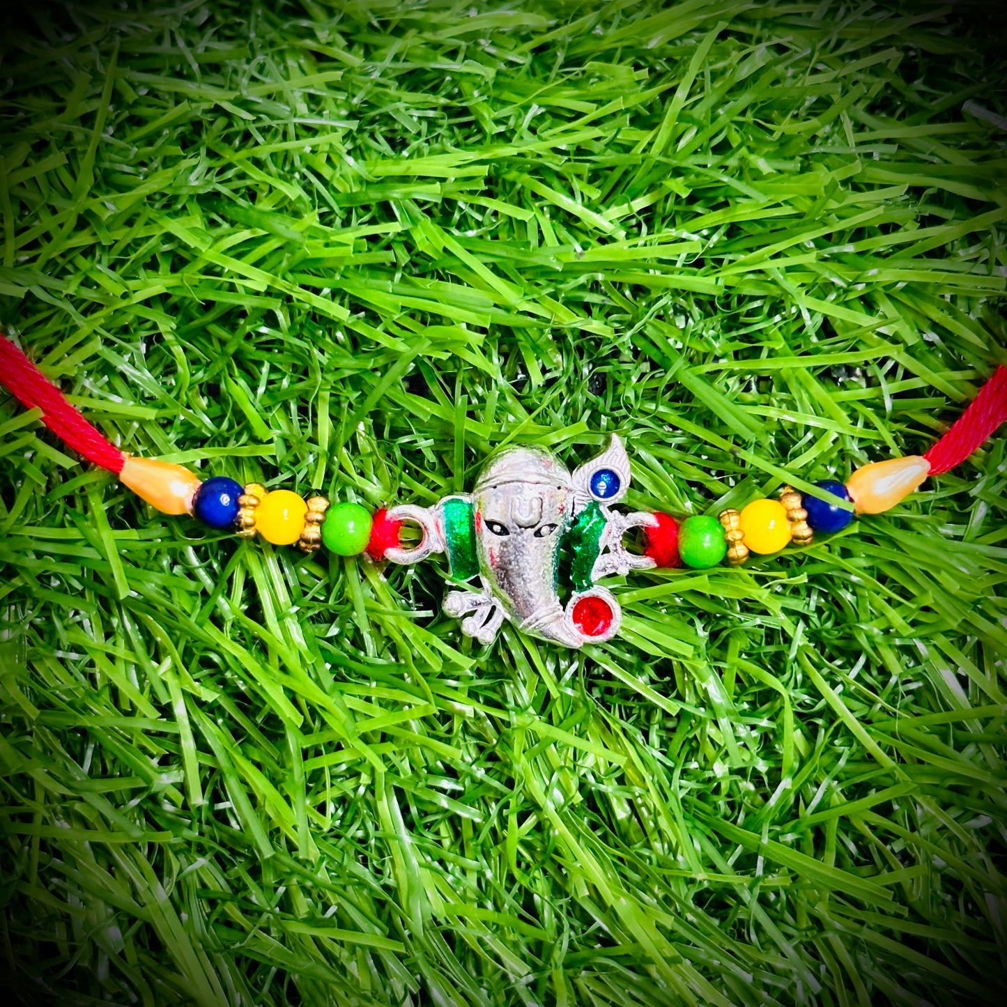 (NP) GANAPATHI DESIGN 625 ORIGINAL SILVER RAKHI 1 PIECE (STRING CONNECT) WITH CHOCOLATE FOR YOUR LOVEABLE BROTHER (A PRICELESS BOND) BY RAJLAXMI.