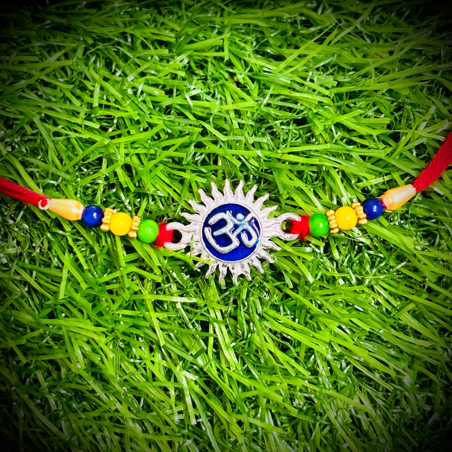 (NP) SURYA OM DESIGN 625 ORIGINAL SILVER RAKHI 1 PIECE (STRING CONNECT) WITH CHOCOLATE FOR YOUR LOVEABLE BROTHER (A PRICELESS BOND) BY RAJLAXMI.