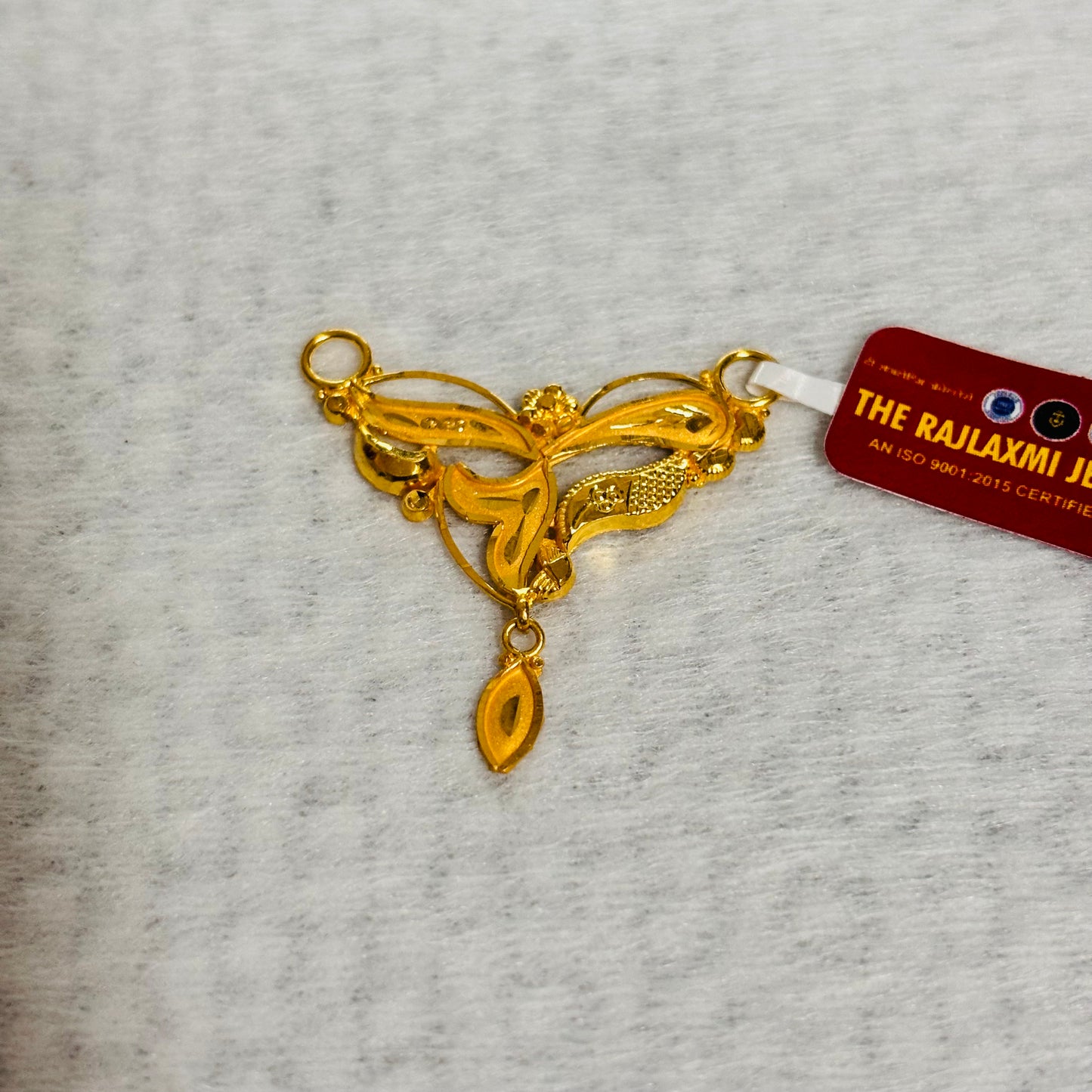 (RP) APPROX WGT: 1.230 GM HUID HALLMARK 22KT GOLD PENDANT (1 PIECE) WITH FREE TASSLE MANGALSUTRA BY RAJLAXMI.