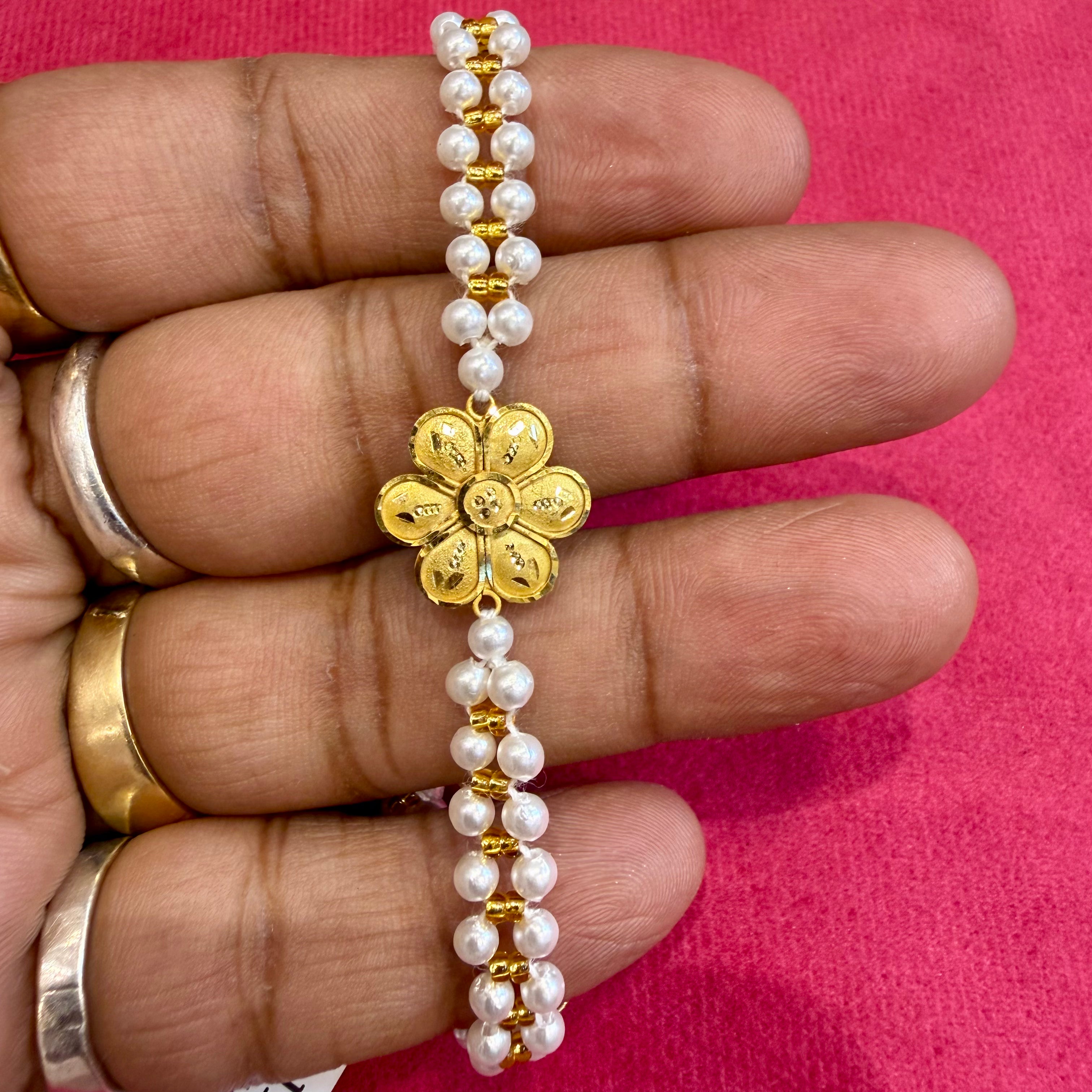 GOLD WRISTLET FOR BABY- BIS CERTIFIED HUID HALLMARK 375 9KT GOLD MOTI WRISTLET (WGT: 0.370 - 0.480 GM APPROX) WITH PEARL CHAIN FOR WOMEN (ADJUSTABLE SIZE).