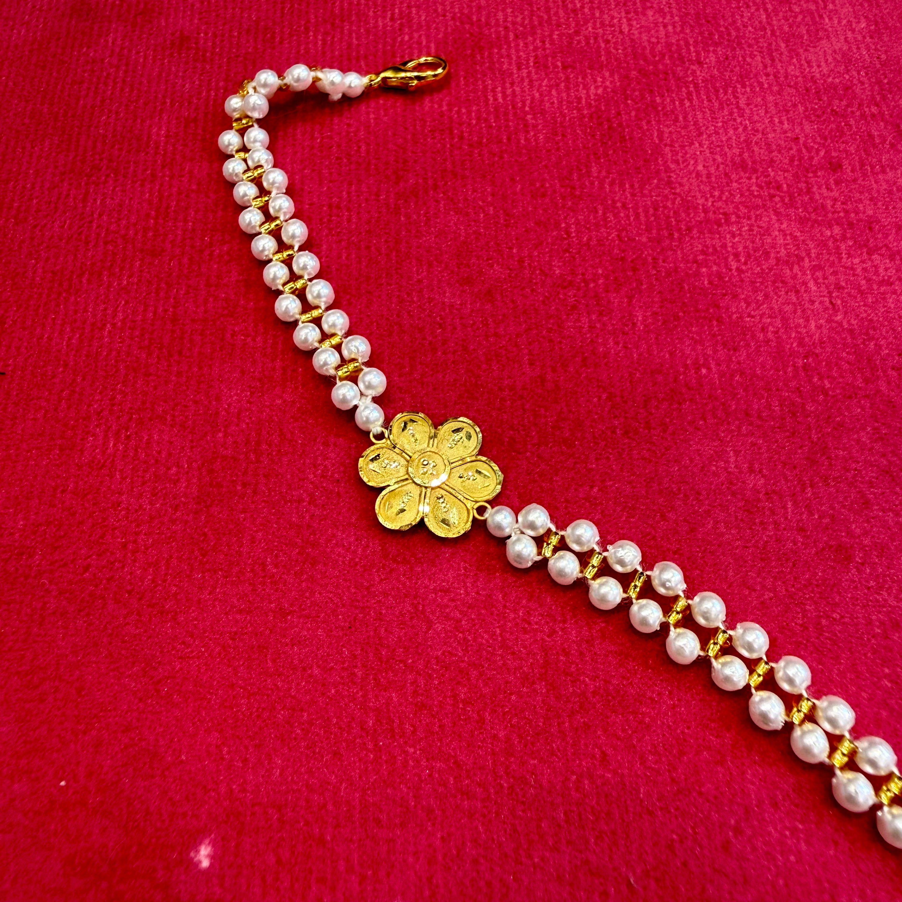 GOLD WRISTLET FOR BABY- BIS CERTIFIED HUID HALLMARK 375 9KT GOLD MOTI WRISTLET (WGT: 0.370 - 0.480 GM APPROX) WITH PEARL CHAIN FOR WOMEN (ADJUSTABLE SIZE).