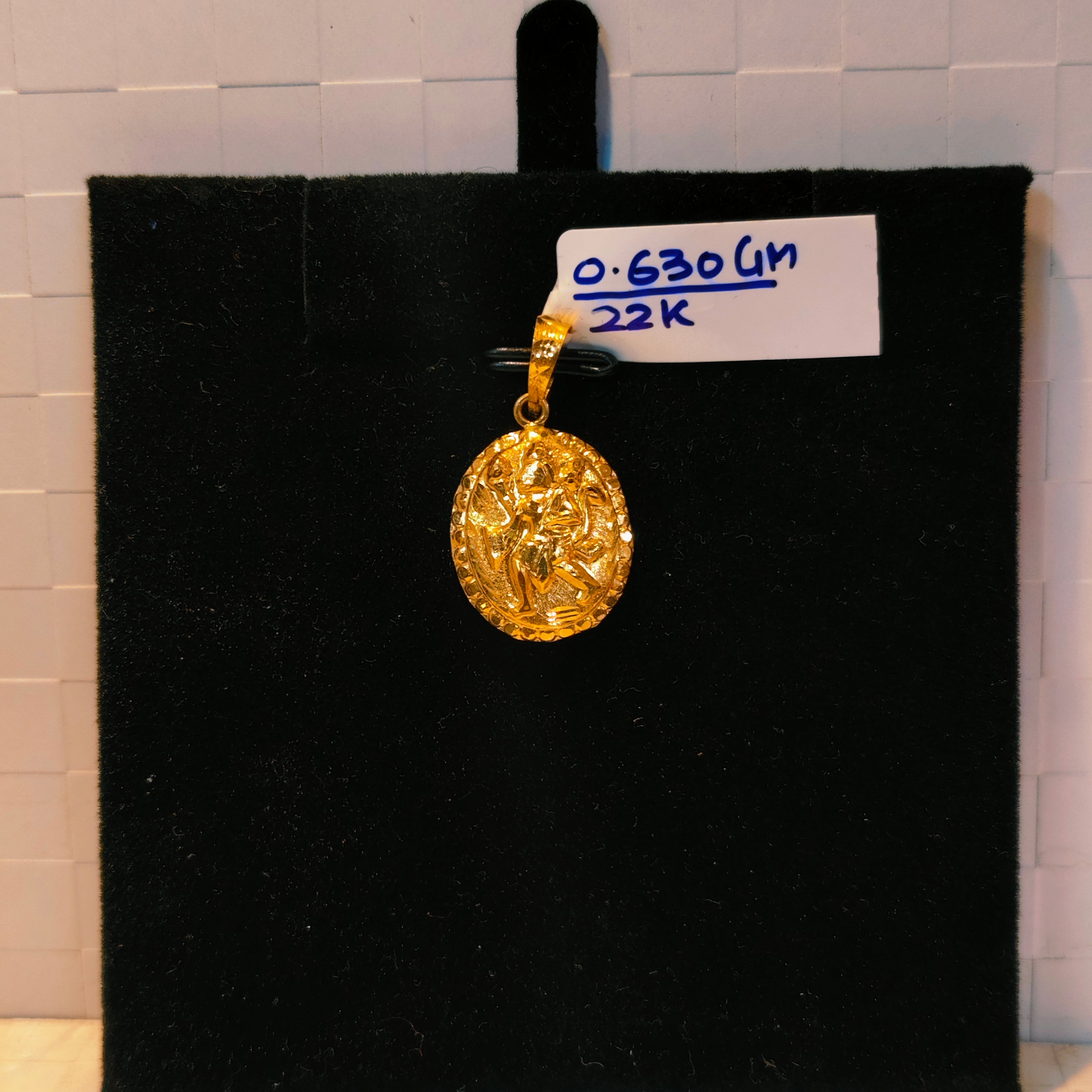 (GLC22) TRJ WGT: 0.630 GM APPROX 22KT HUID HALLMARK GOLD LOCKET 1 PIECE WITH ADJUSTABLE TASSEL.