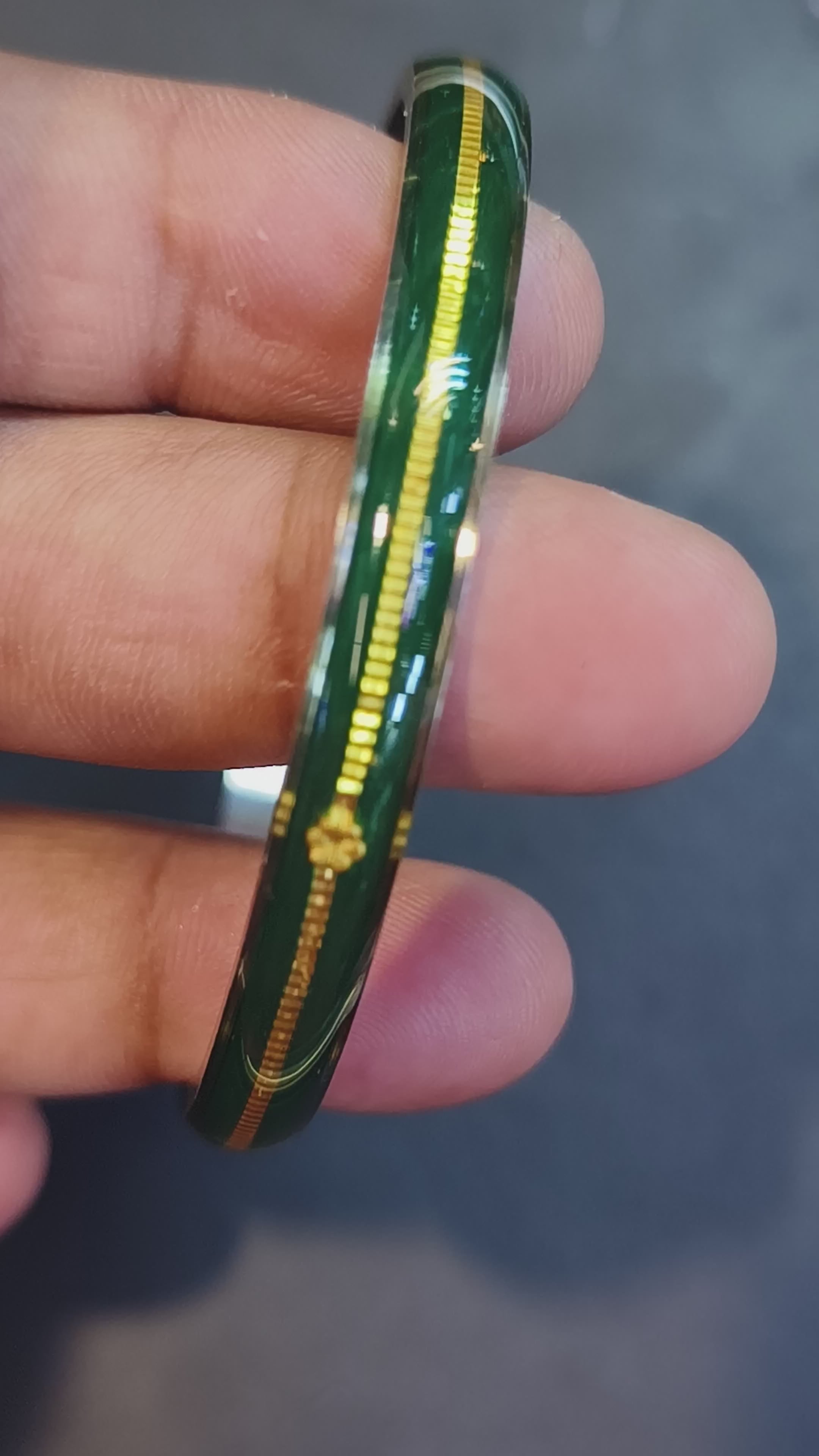 Load video: (FACEBOOK VIRAL) GREEN GLASS LAMINATED HUID HALLMARK 22KT GOLD NOA BANGLES VIRAL NOA 1 PIECE APP. WGT: 0.100 - 0.150 GM WITH PURITY CARD ( FUTURE EXCHANGE VALUE  RS 1000) WITH ANY JEWELLERY FOR LIFETIME