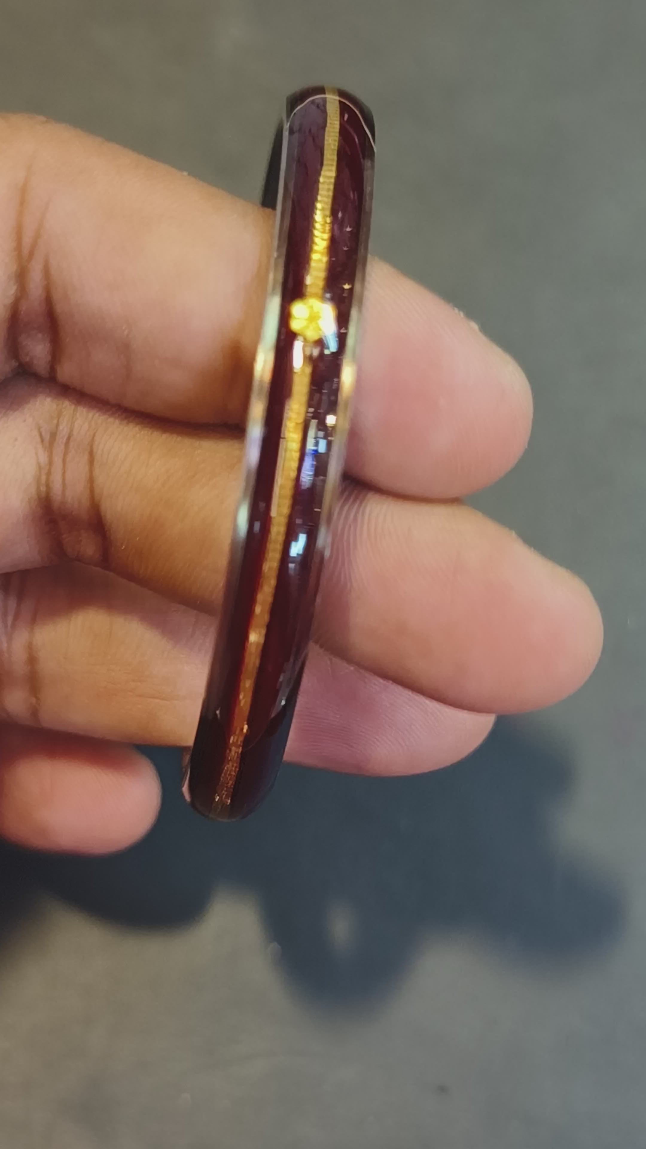 Load video: (FACEBOOK VIRAL) MAROON GLASS LAMINATED HUID HALLMARK 22KT GOLD NOA BANGLES VIRAL NOA 1 PIECE APP. WGT: 0.100 - 0.150 GM WITH PURITY CARD ( FUTURE EXCHANGE VALUE  RS 1000) WITH ANY JEWELLERY FOR LIFETIME