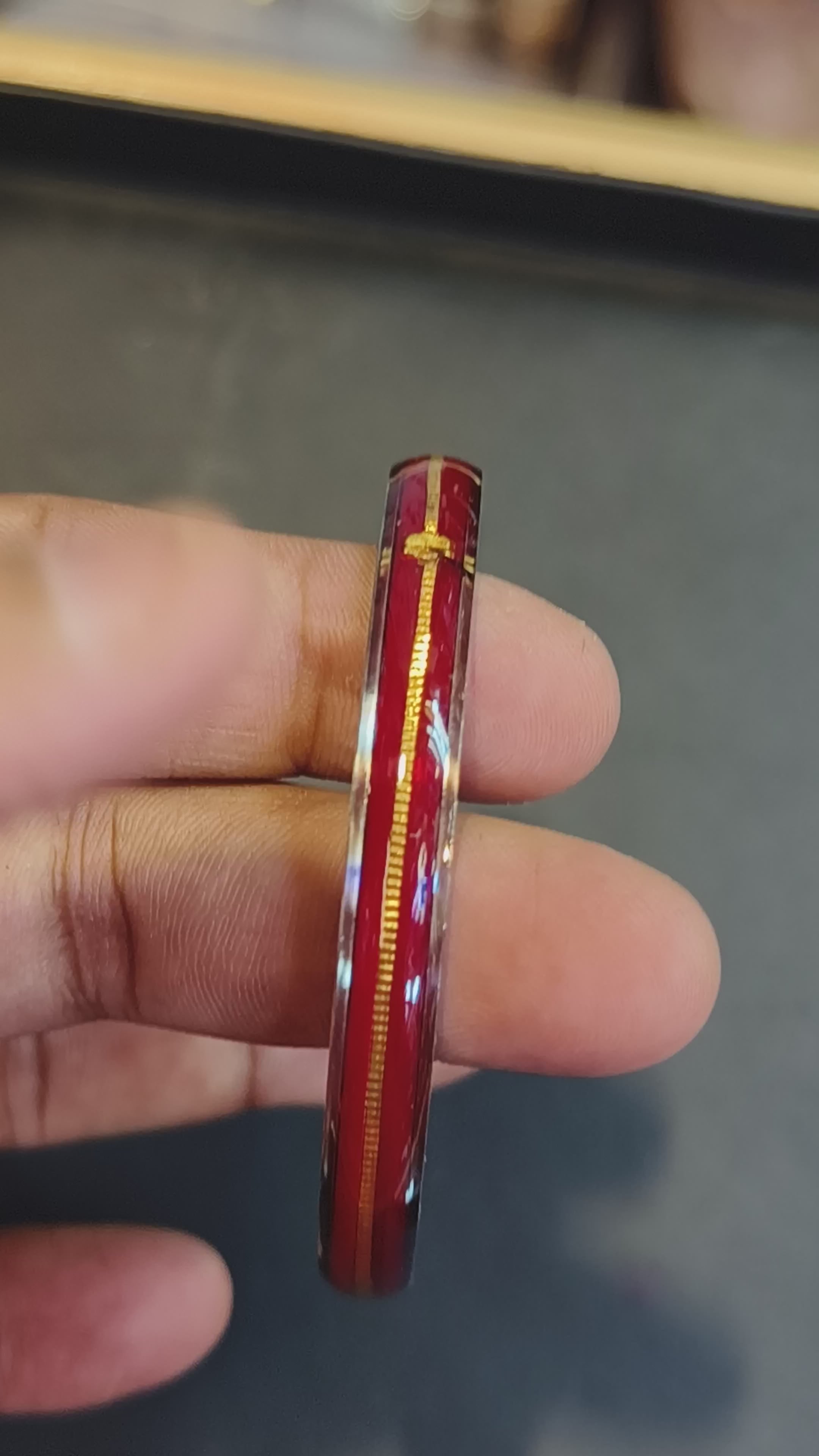 Load video: (FACEBOOK VIRAL) RED GLASS LAMINATED HUID HALLMARK 22KT GOLD NOA BANGLES VIRAL NOA 1 PIECE APP. WGT: 0.100 - 0.150 GM WITH PURITY CARD ( FUTURE EXCHANGE VALUE  RS 1000) WITH ANY JEWELLERY FOR LIFETIME