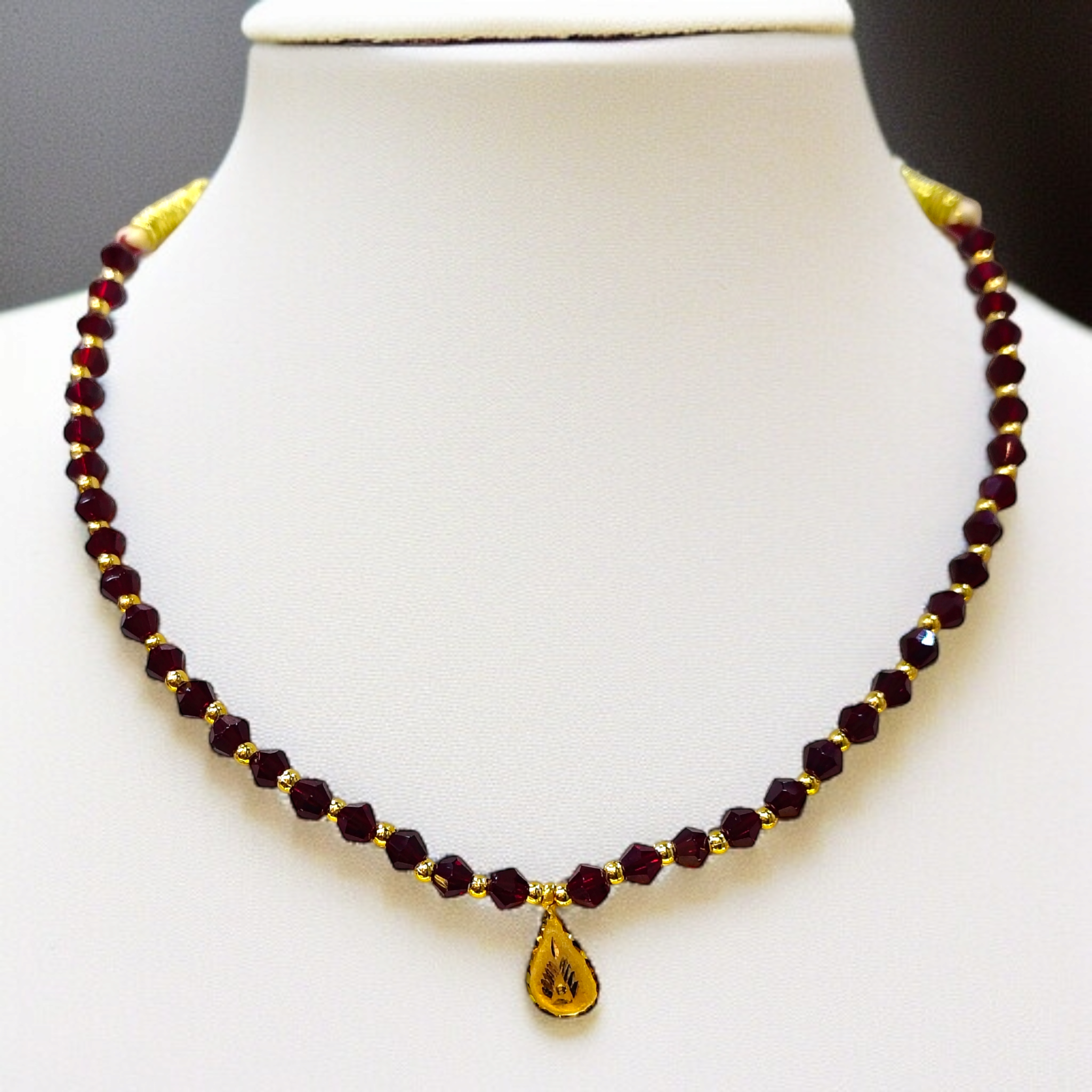 (GML) TRJ WGT: 0.140 GM APPROX KDM GOLD DROP DESIGN LOCKET 1 PIECE WITH MAROON CRYSTAL ADJUSTABLE TASSEL FOR GIFT PURPOSE (50 TONCH).