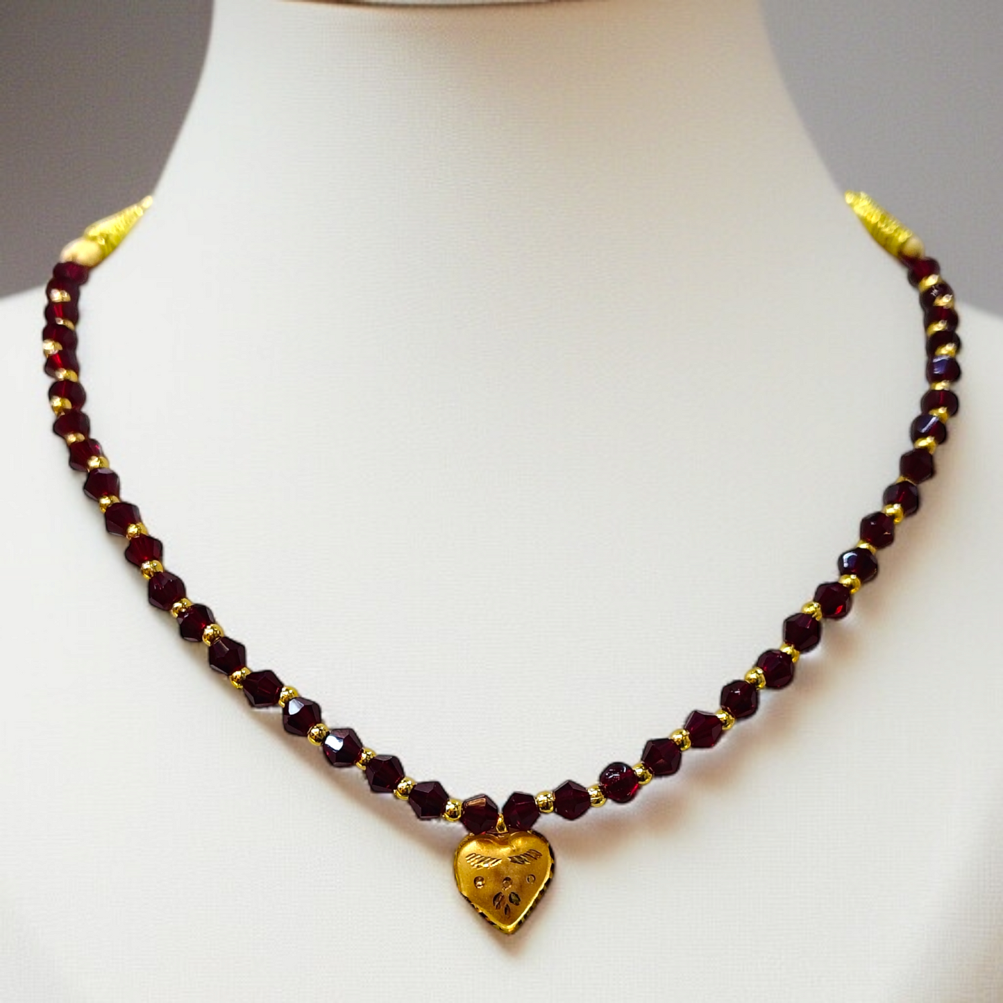 TRJ WGT: 0.150 GM APPROX KDM GOLD LOVE DESIGN LOCKET 1 PIECE WITH MAROON CRYSTAL ADJUSTABLE TASSEL FOR GIFT PURPOSE (50 TONCH).