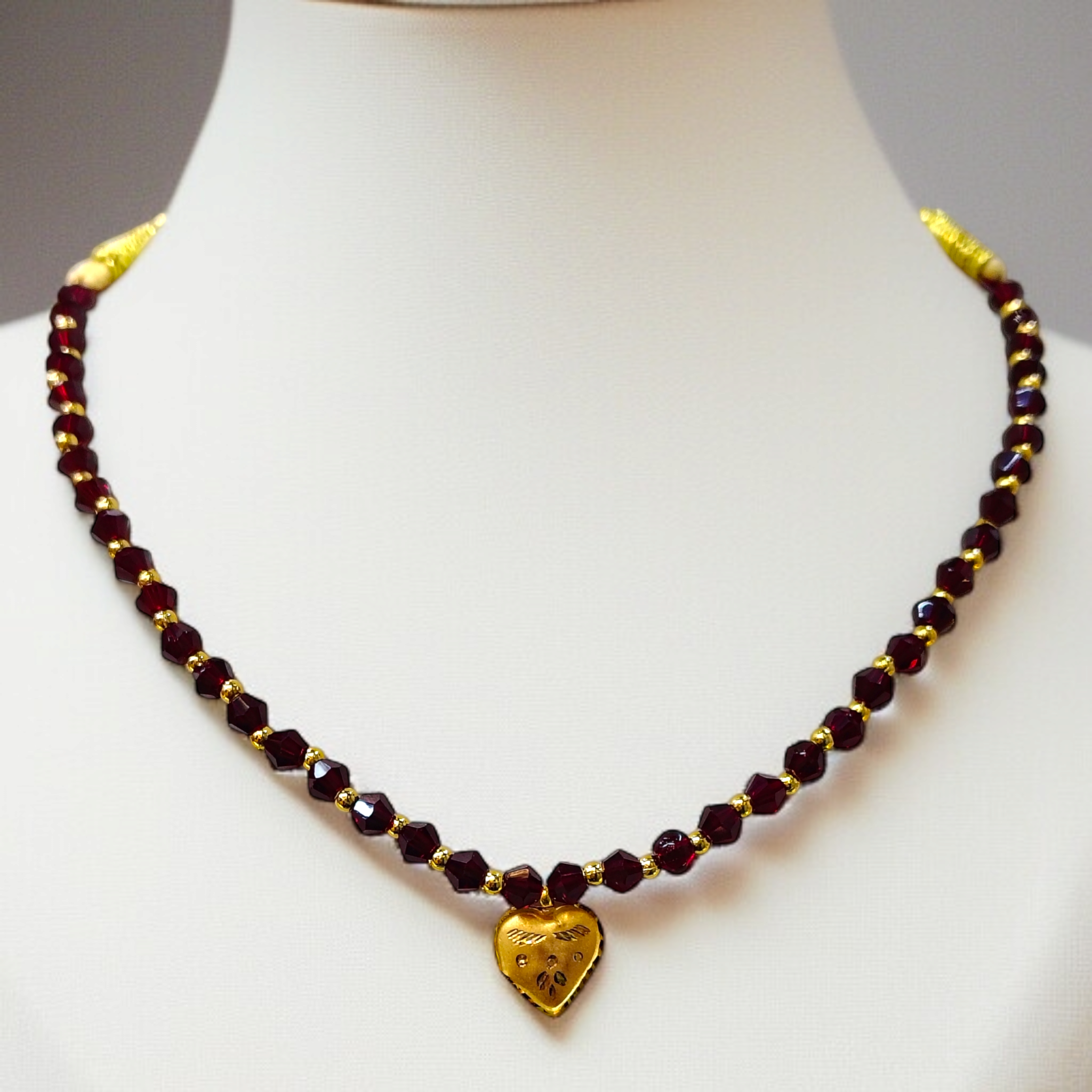 (GML) TRJ WGT: 0.150 GM APPROX KDM GOLD LOVE DESIGN LOCKET 1 PIECE WITH MAROON CRYSTAL ADJUSTABLE TASSEL FOR GIFT PURPOSE (50 TONCH).
