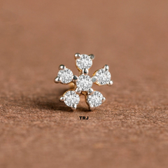 NOSEPIN- RAJLAXMI DIAMOND JEWELLERY - WGT: 0.215 GM - NATURAL DIAMOND (0.10 CENT) HUID HALLMARK 18KT DIAMOND NOSEPIN FOR WOMEN WITH CERTIFICATE OF AUTHENTICITY BY IGJI (DESIGN NO: M12082574).