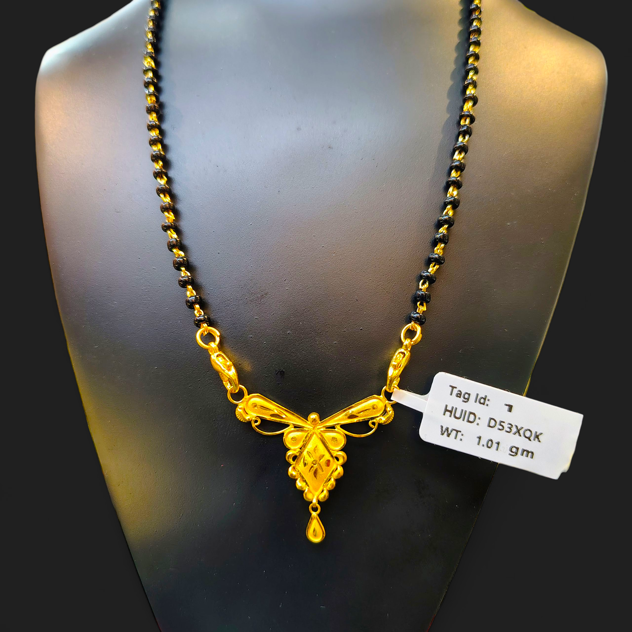 (GPM) TRJ WGT: 1.010 GM APPROX 22KT HUID HALLMARK GOLD PENDANT MANGALSUTRA 1 PIECE WITH TASSEL.