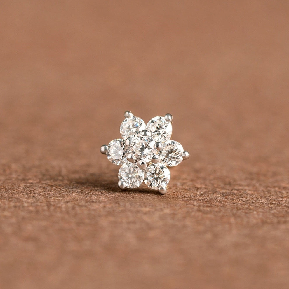 NOSEPIN- RAJLAXMI DIAMOND JEWELLERY - WGT: 0.205 GM - NATURAL DIAMOND (0.05 CENT) HUID HALLMARK 18KT DIAMOND NOSEPIN FOR WOMEN WITH CERTIFICATE OF AUTHENTICITY BY IGJI (DESIGN NO: M12082567).