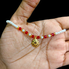 GOLD LOCKET- WGT: 0.240 GM APPROX BIS CERTIFIED HUID HALLMARK 22KT GOLD MOTI LOCKET 1 PIECE FOR WOMEN (WITH PUTI CHAIN).