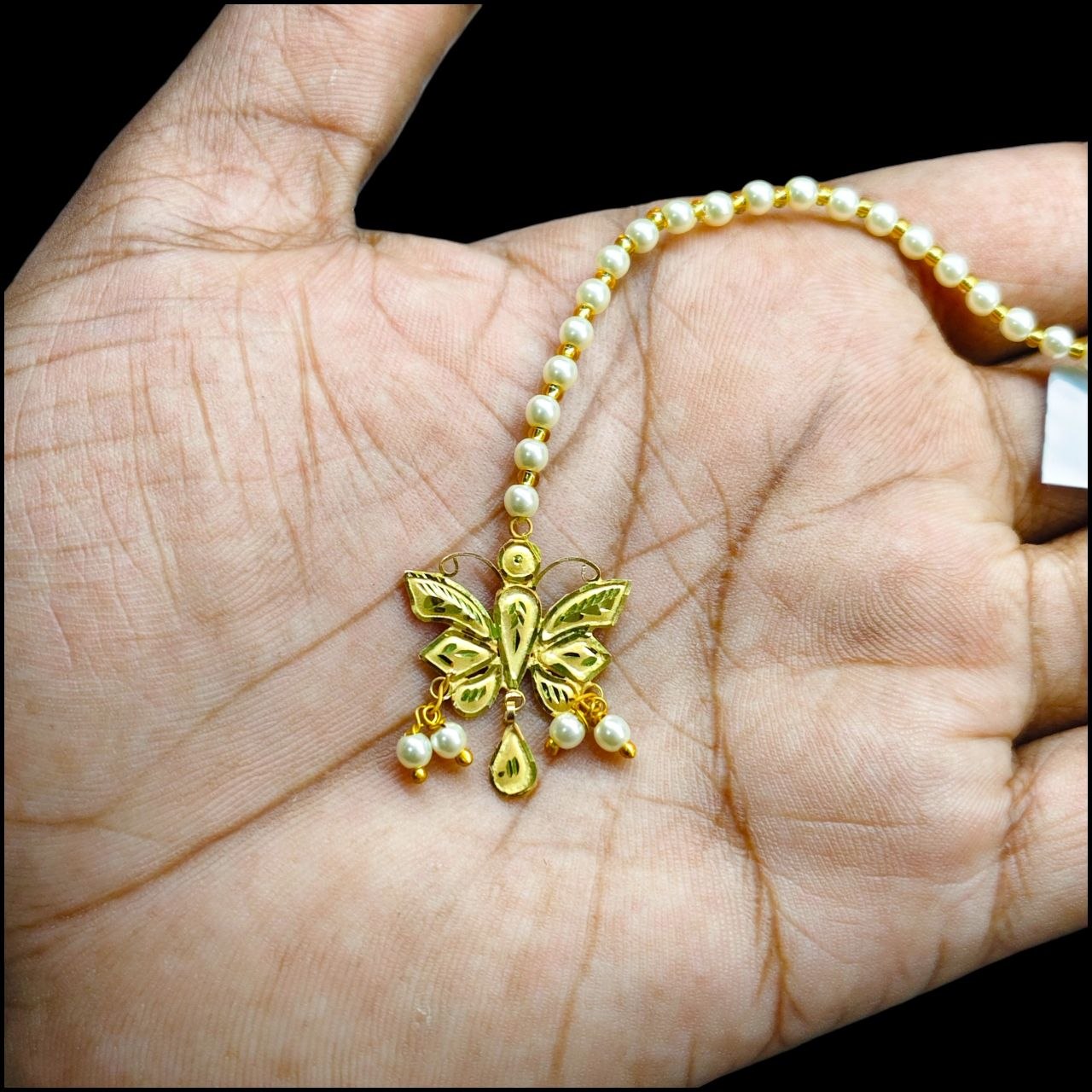 GOLD TICKLY- (WGT: 0.660 GM APPROX) CERTIFIED BIS HUID HALLMARK 375 9KT GOLD TICKLY (MANGTIKA) 1 PIECE FOR MARRIAGE.