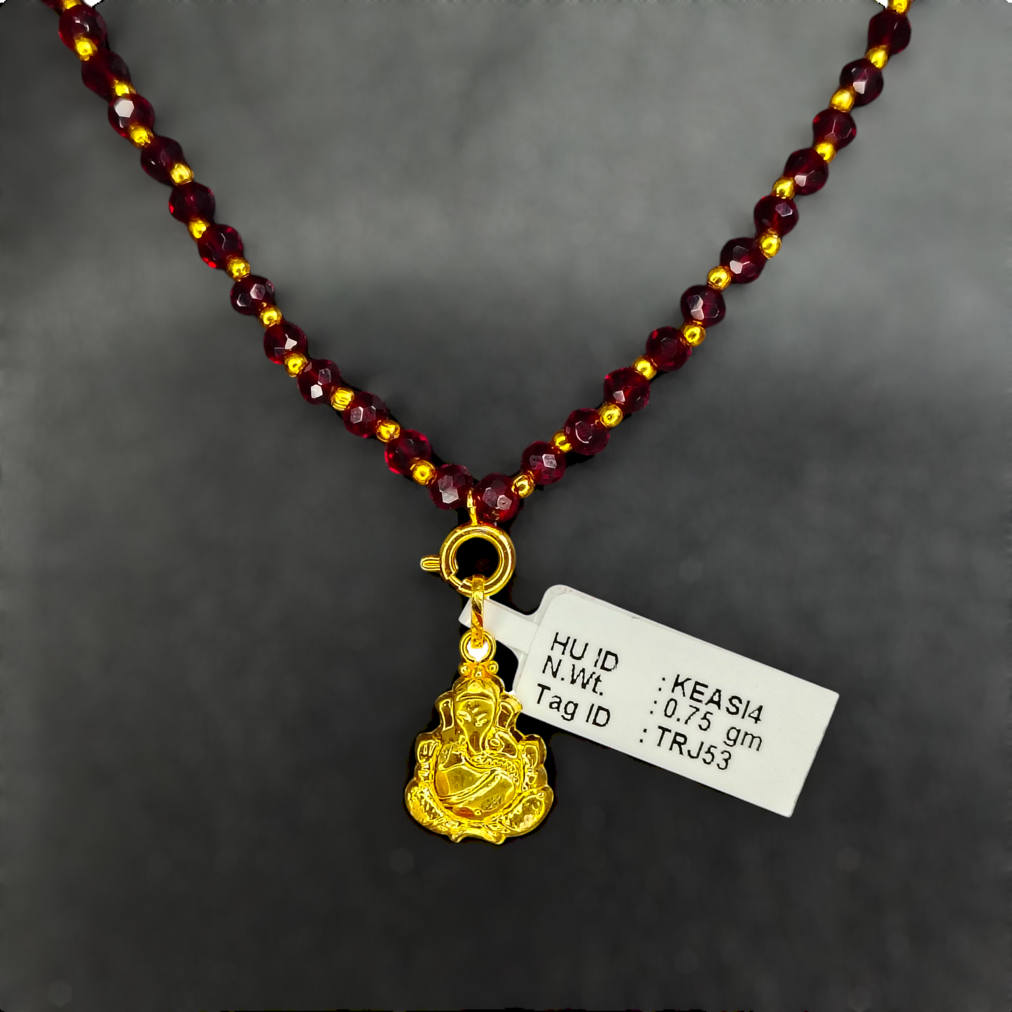 TRJ WGT: 0.750 GM APPROX 22KT HUID HALLMARK GOLD LOCKET 1 PIECE WITH ADJUSTABLE TASSEL.
