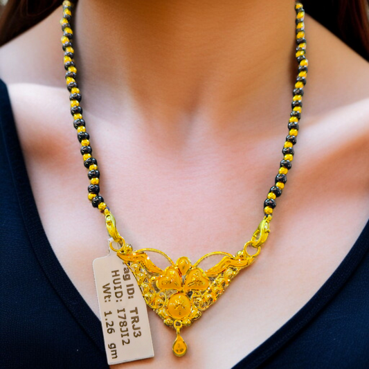 TRJ WGT: 1.260 GM APPROX 22KT HUID HALLMARK GOLD PENDANT MANGALSUTRA 1 PIECE WITH TASSEL.