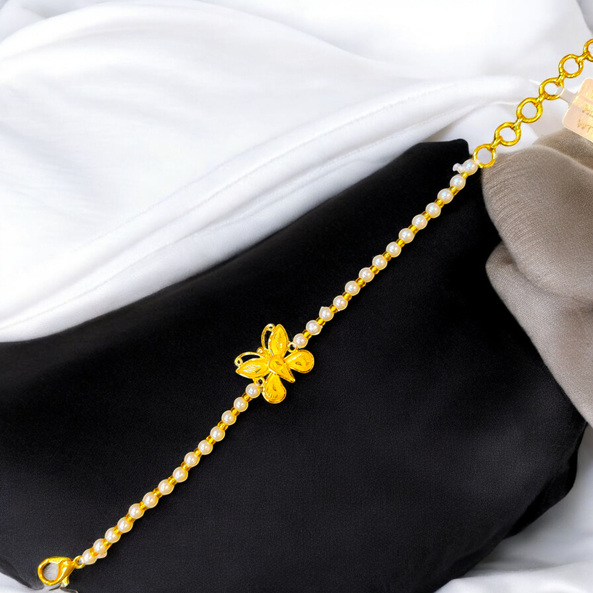 (GMW) RAJLAXMI BIS CERTIFIED HUID HALLMARK 916 22KT GOLD WRISTLET WITH PEARL CHAIN FOR WOMEN.