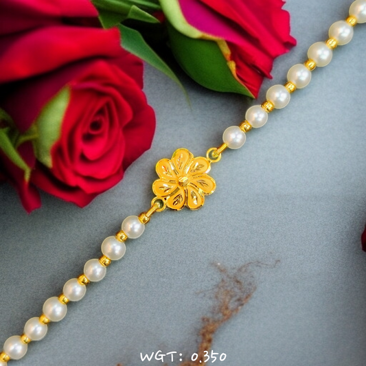 RAJLAXMI WGT: 0.350 GM APPROX HUID HALLMARK 916 22KT GOLD WRISTLET WITH PEARL CHAIN FOR BABY.