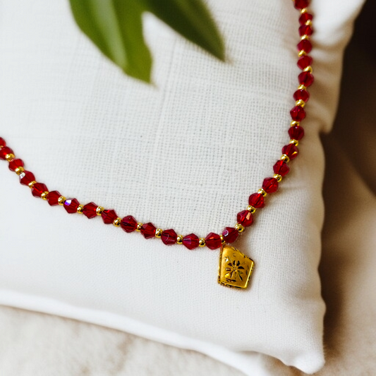 TRJ WGT: 0.150 GM APPROX KDM GOLD BORFI DESIGN LOCKET 1 PIECE WITH RED CRYSTAL ADJUSTABLE TASSEL FOR GIFT PURPOSE (50 TONCH).