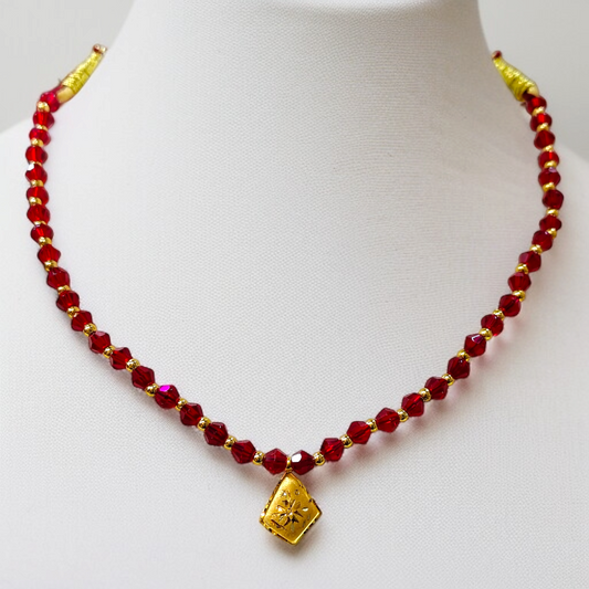 TRJ WGT: 0.150 GM APPROX KDM GOLD BORFI DESIGN LOCKET 1 PIECE WITH RED CRYSTAL ADJUSTABLE TASSEL FOR GIFT PURPOSE (50 TONCH).