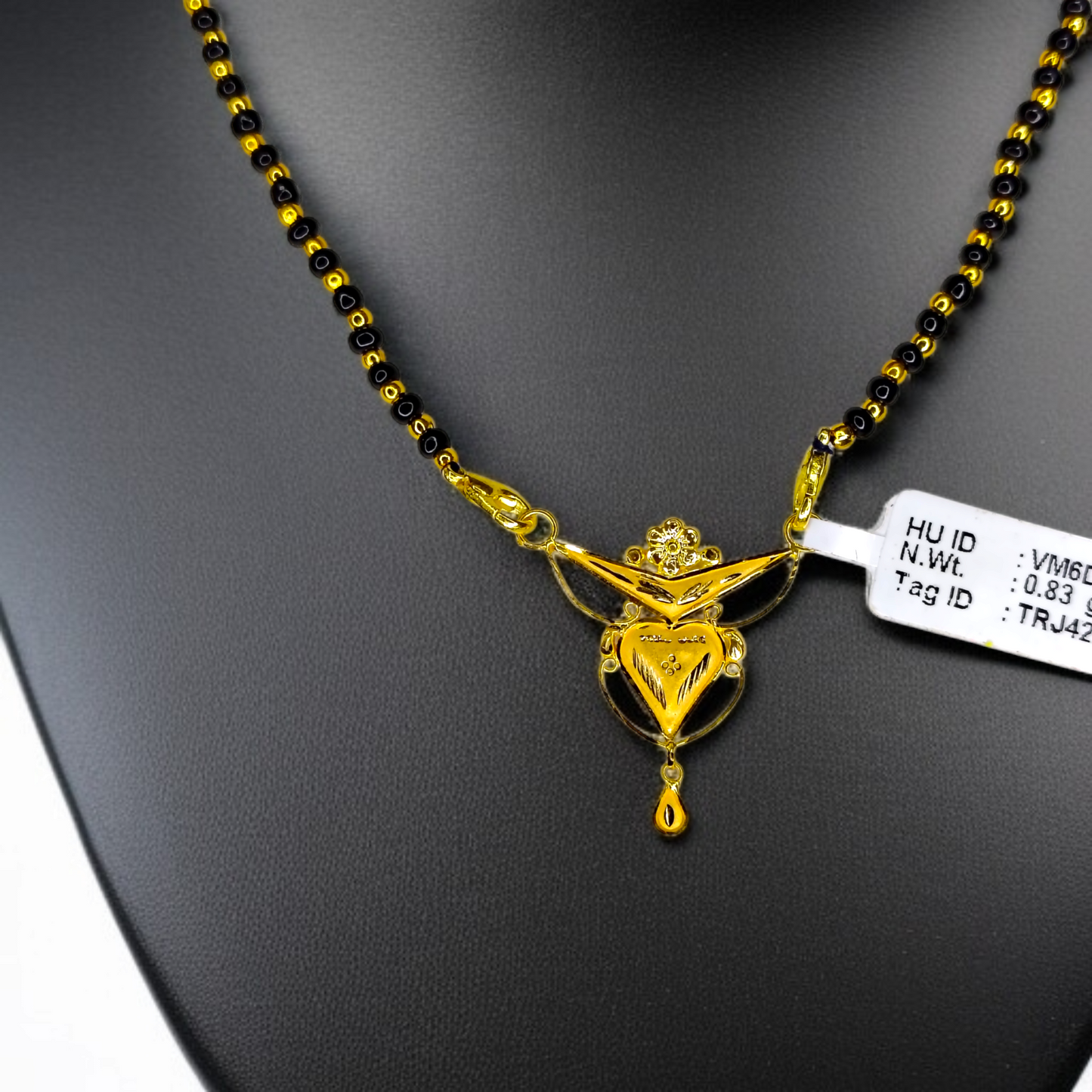 TRJ WGT: 0.830 GM APPROX 22KT HUID HALLMARK GOLD PENDANT MANGALSUTRA 1 PIECE WITH TASSEL.