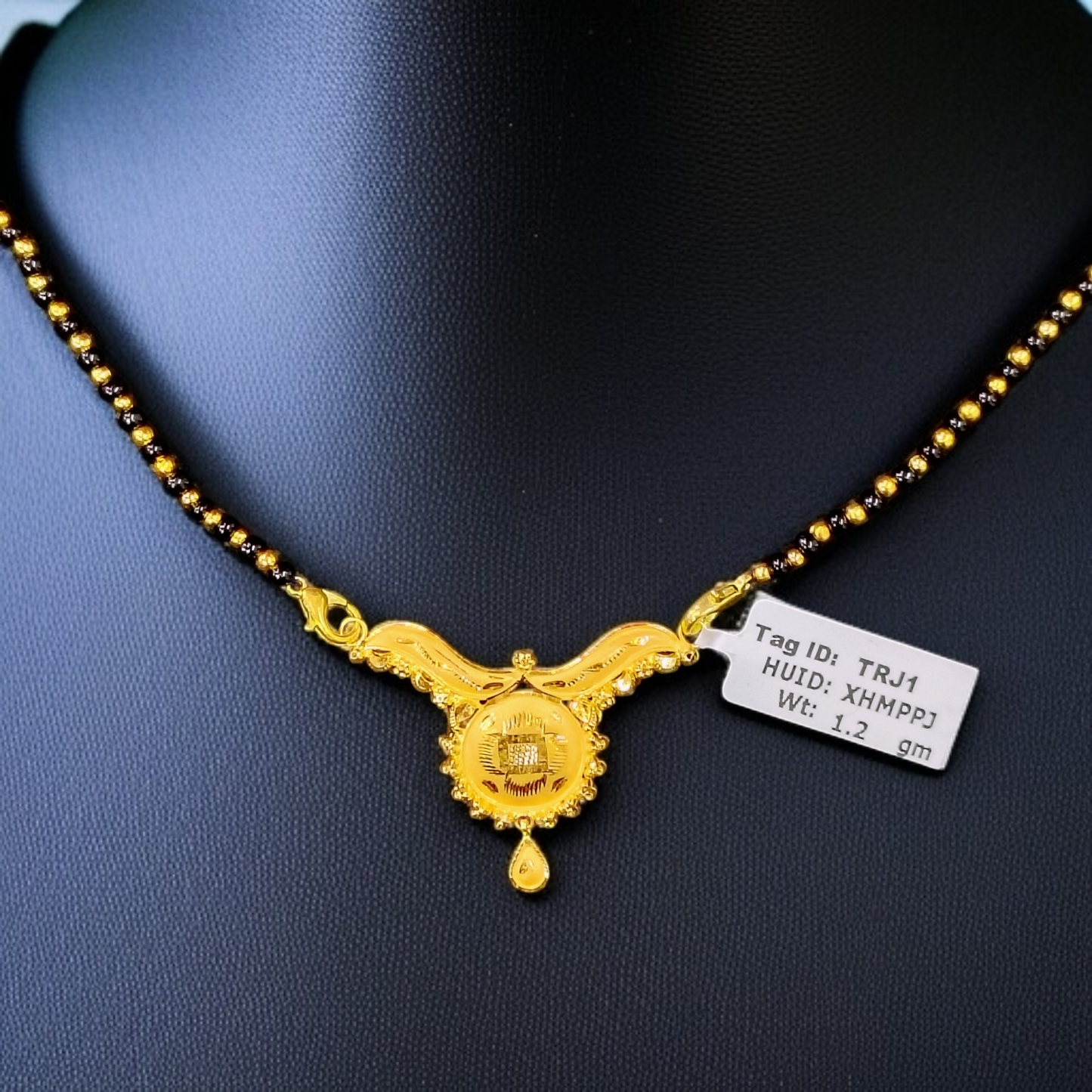 TRJ WGT: 1.200 GM APPROX 22KT HUID HALLMARK GOLD PENDANT MANGALSUTRA 1 PIECE WITH TASSEL.