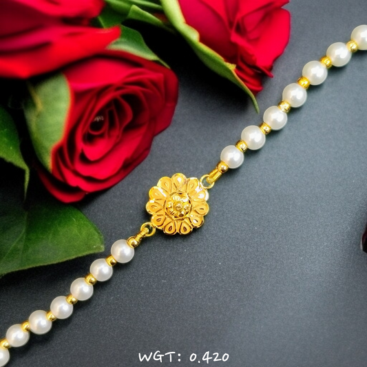 RAJLAXMI WGT: 0.420 GM APPROX HUID HALLMARK 916 22KT GOLD WRISTLET WITH PEARL CHAIN FOR BABY.