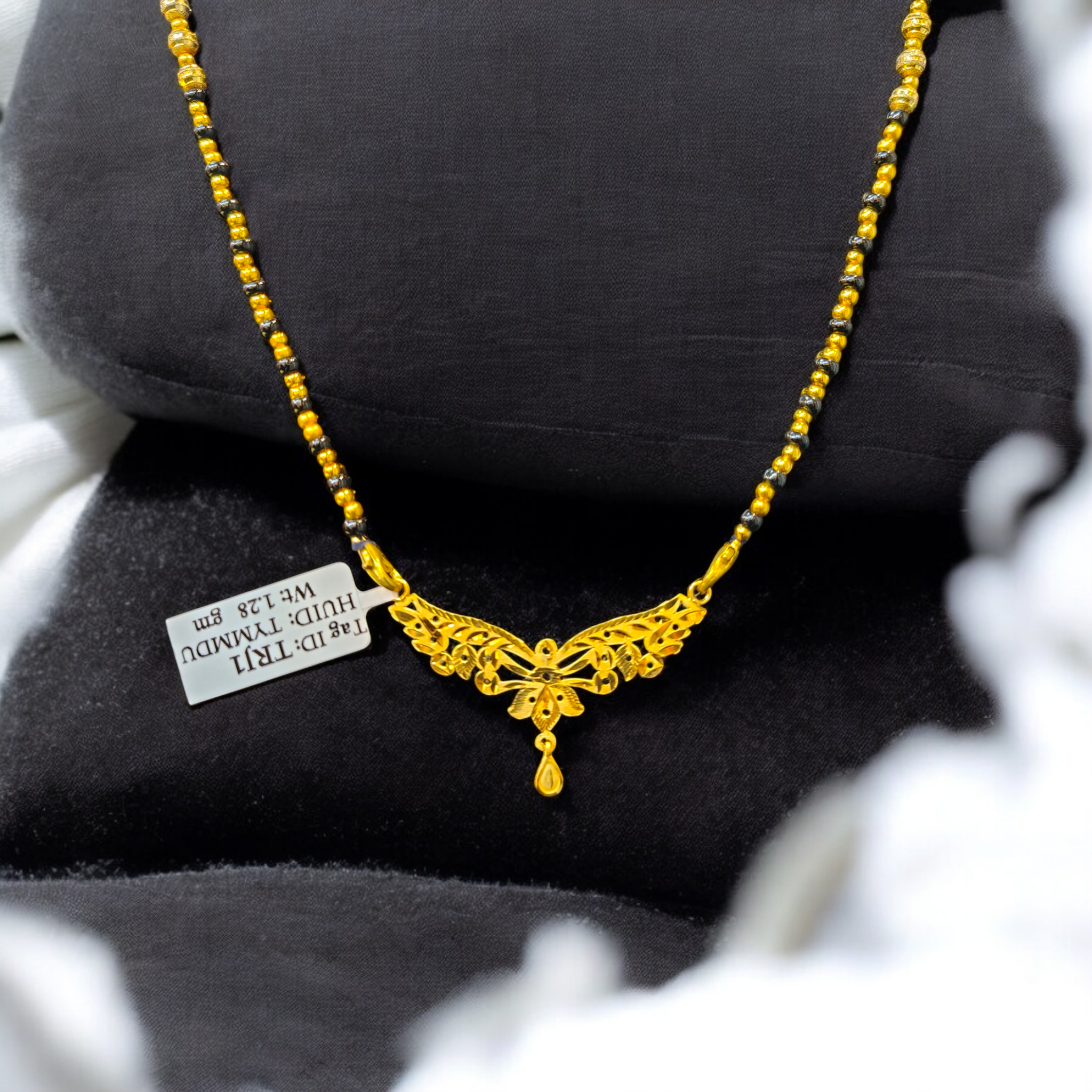 (GPM) TRJ WGT: 1.280 GM APPROX 22KT HUID HALLMARK GOLD PENDANT MANGALSUTRA 1 PIECE WITH TASSEL.