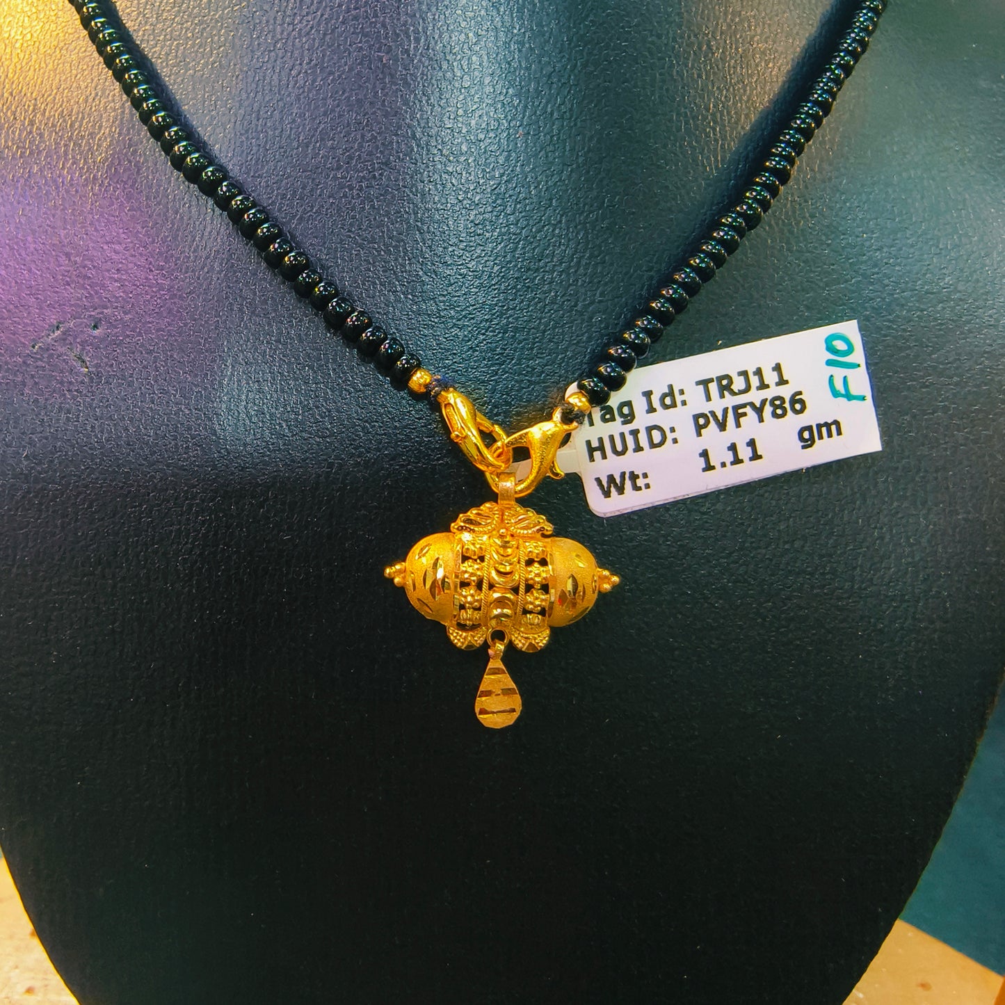 JITIYA DESIGN HUID HALLMARK 22KT GOLD PENDANT (1 PIECE) WITH FREE TASSLE MANGALSUTRA APPROX WGT: 1.110 GM