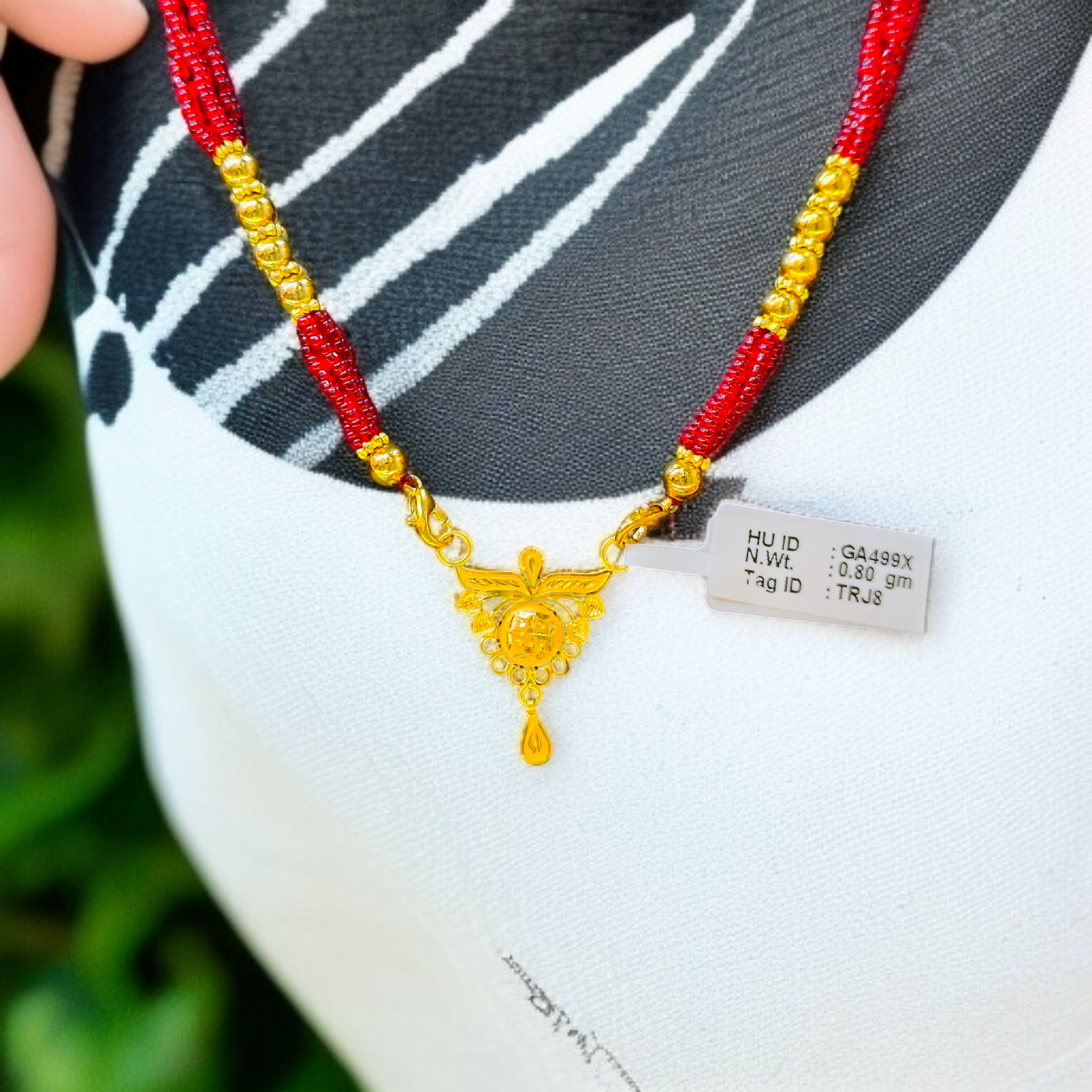(GPM) TRJ WGT: 0.800 GM APPROX 22KT HUID HALLMARK GOLD PENDANT MANGALSUTRA 1 PIECE WITH TASSEL.