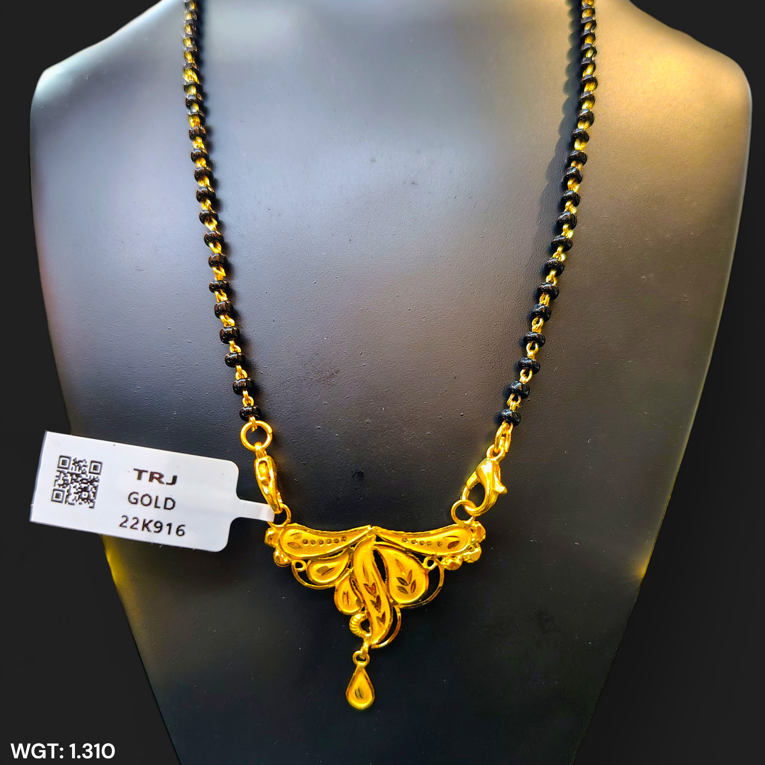 (GPM) TRJ WGT: 1.310 GM APPROX 22KT HUID HALLMARK GOLD PENDANT MANGALSUTRA 1 PIECE WITH TASSEL.