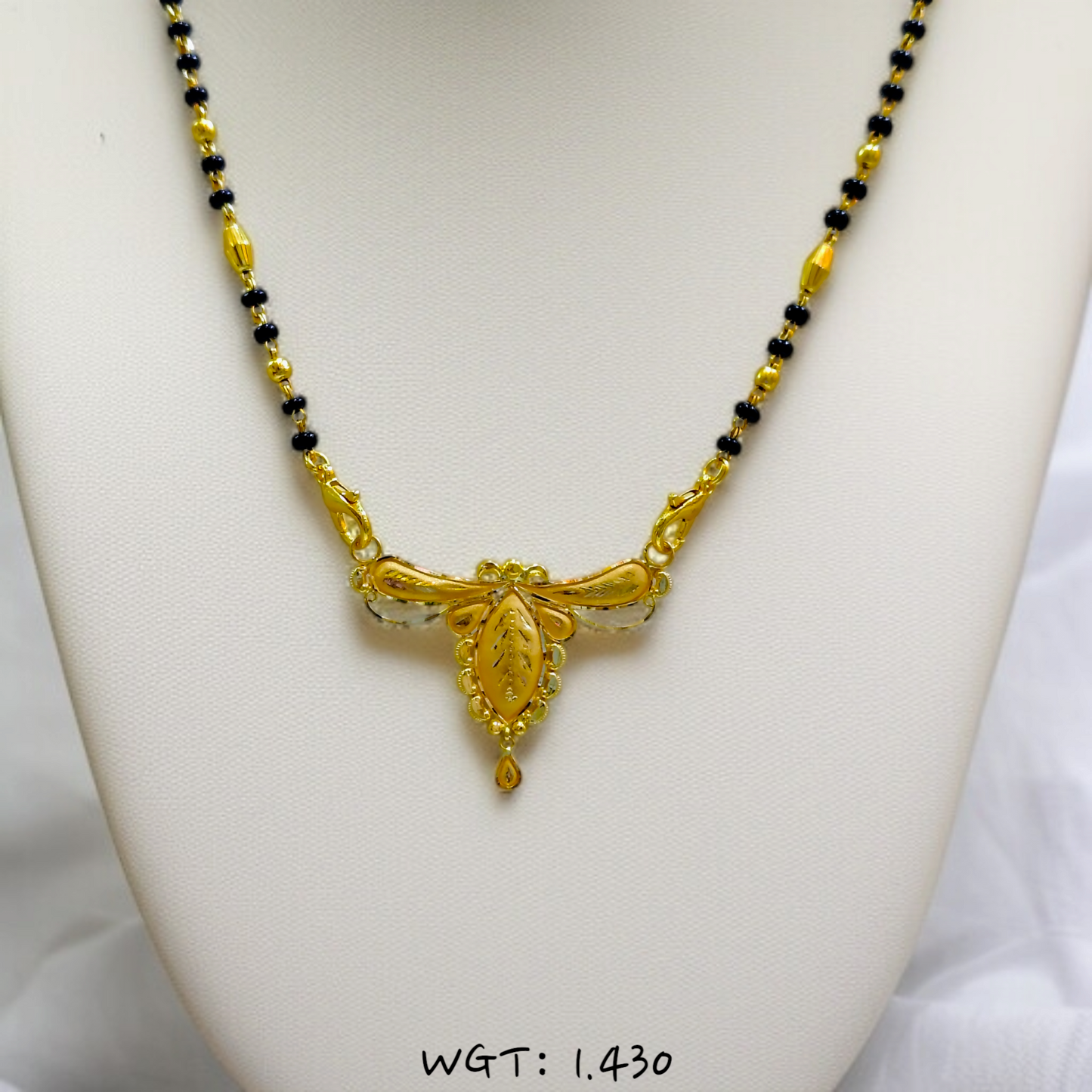 TRJ WGT: 1.430 GM APPROX 22KT HUID HALLMARK GOLD PENDANT MANGALSUTRA 1 PIECE WITH TASSEL.