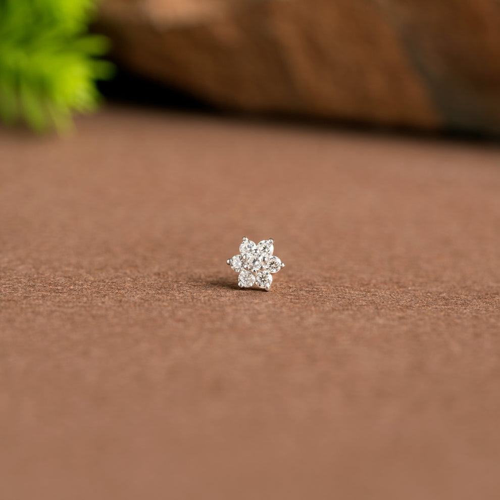 NOSEPIN- RAJLAXMI DIAMOND JEWELLERY - WGT: 0.205 GM - NATURAL DIAMOND (0.05 CENT) HUID HALLMARK 18KT DIAMOND NOSEPIN FOR WOMEN WITH CERTIFICATE OF AUTHENTICITY BY IGJI (DESIGN NO: M12082567).